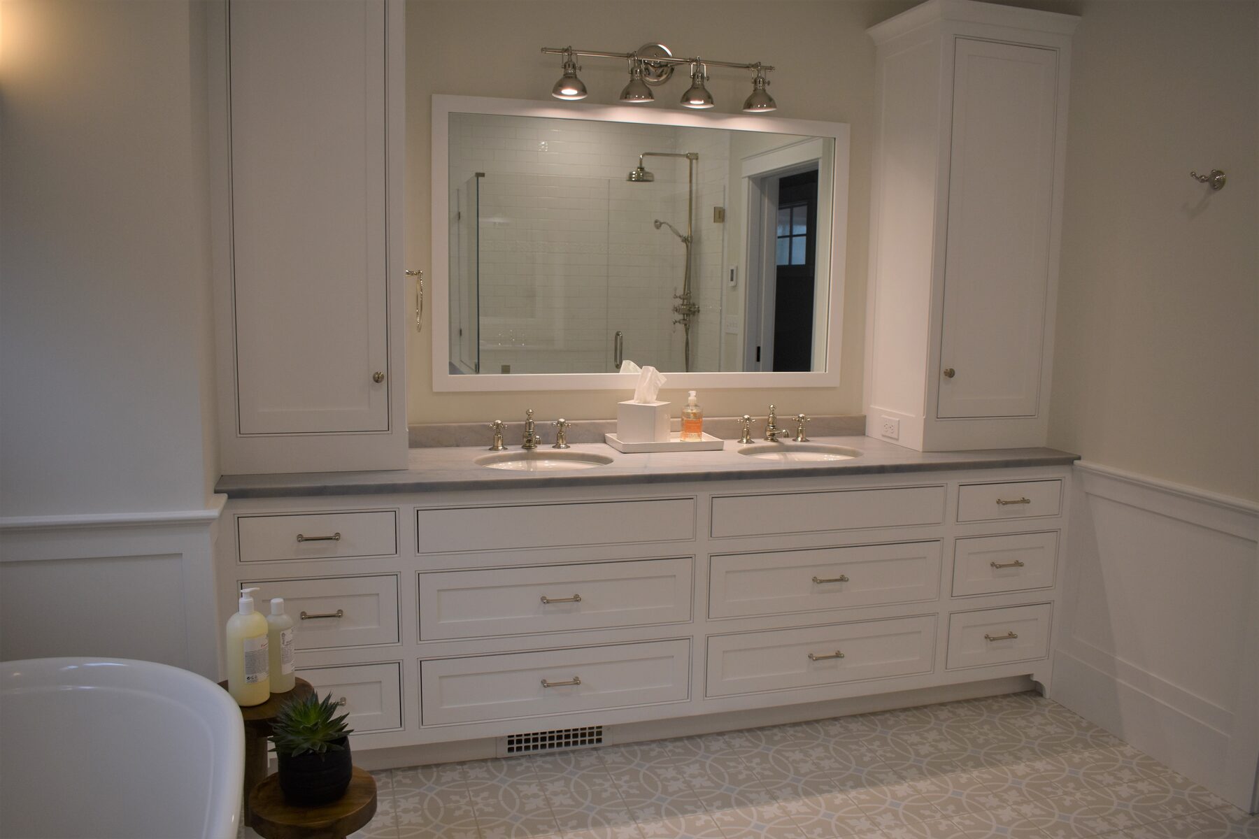 White double bathroom vanity with inset cabinetry