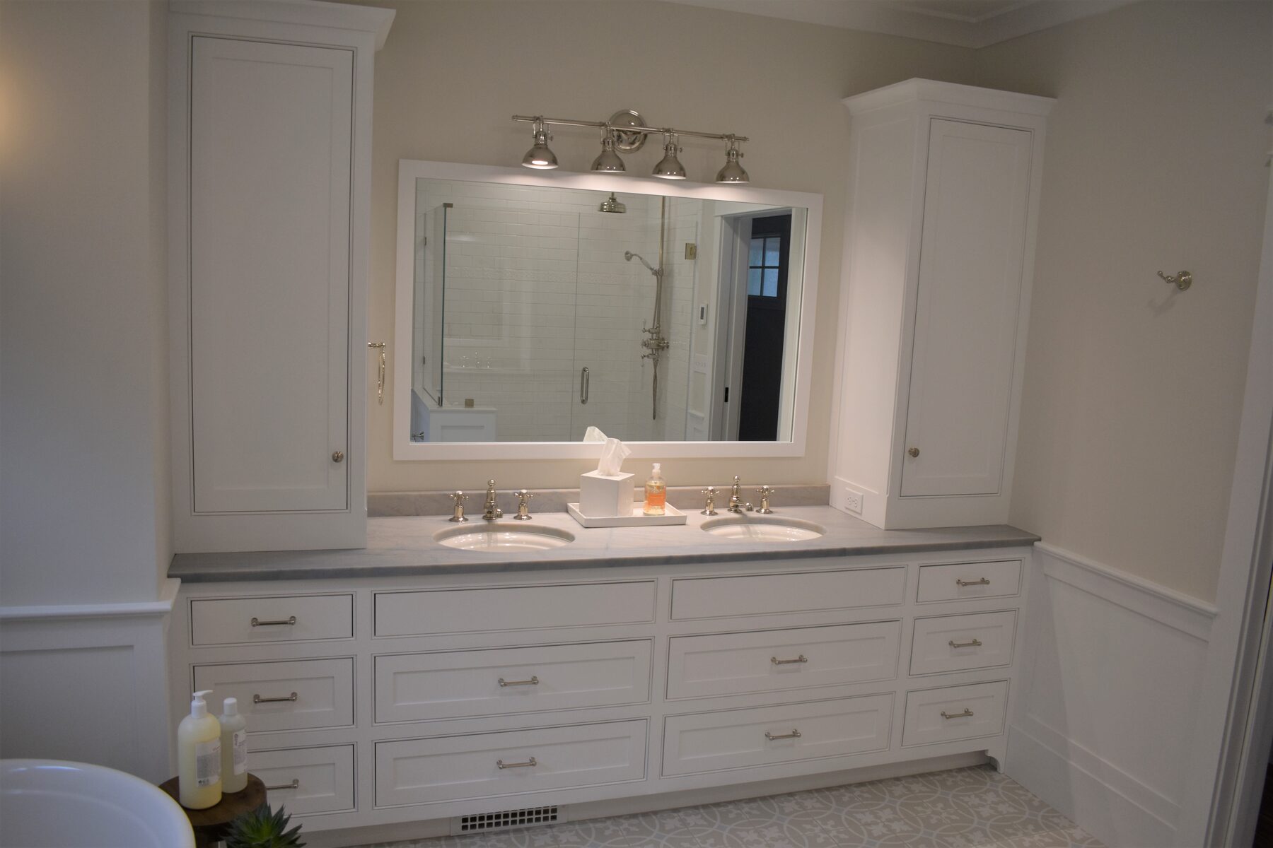 White double bathroom vanity cabinetry detail