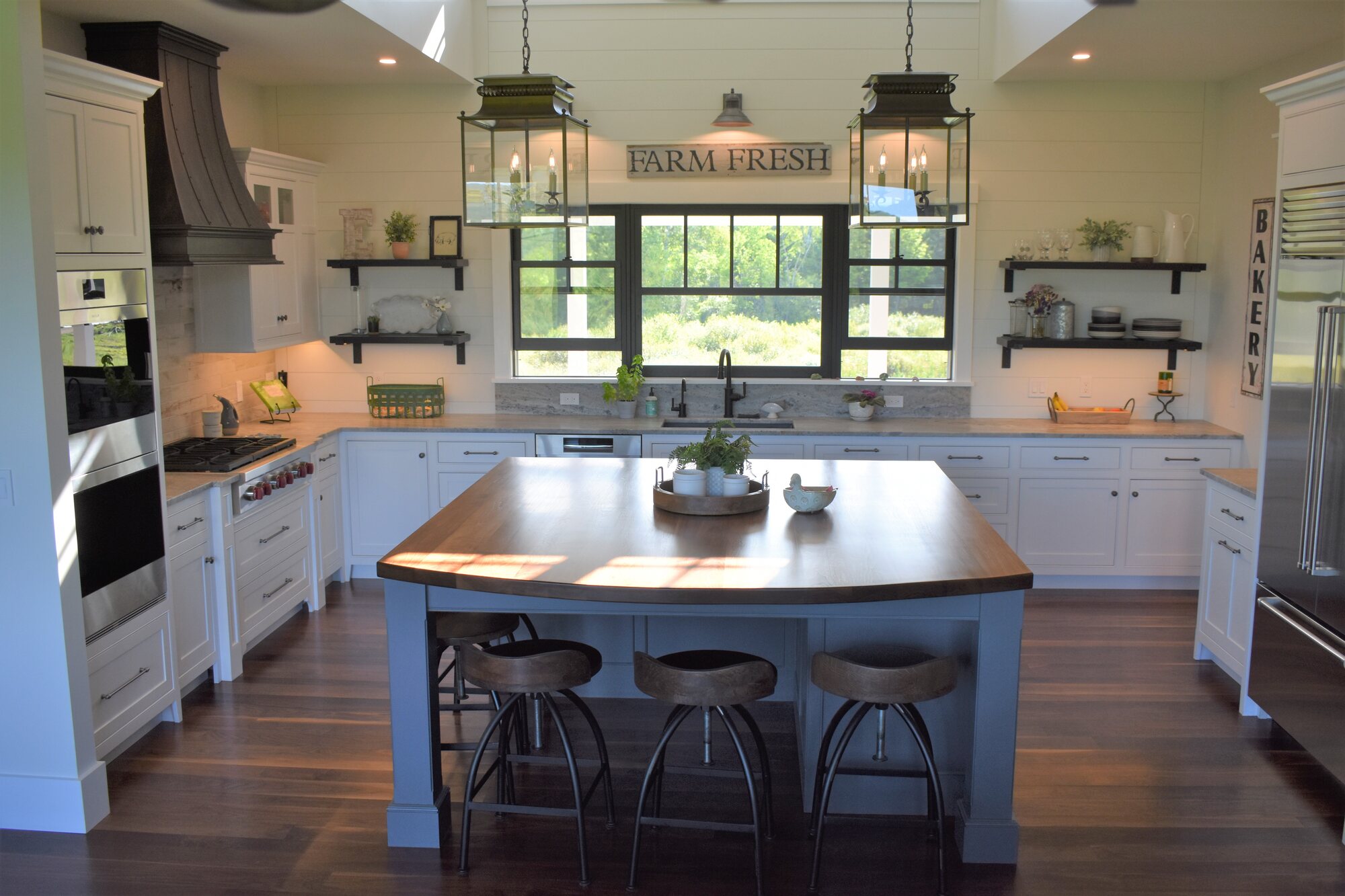 Blue island kitchen wide view with pendant lights