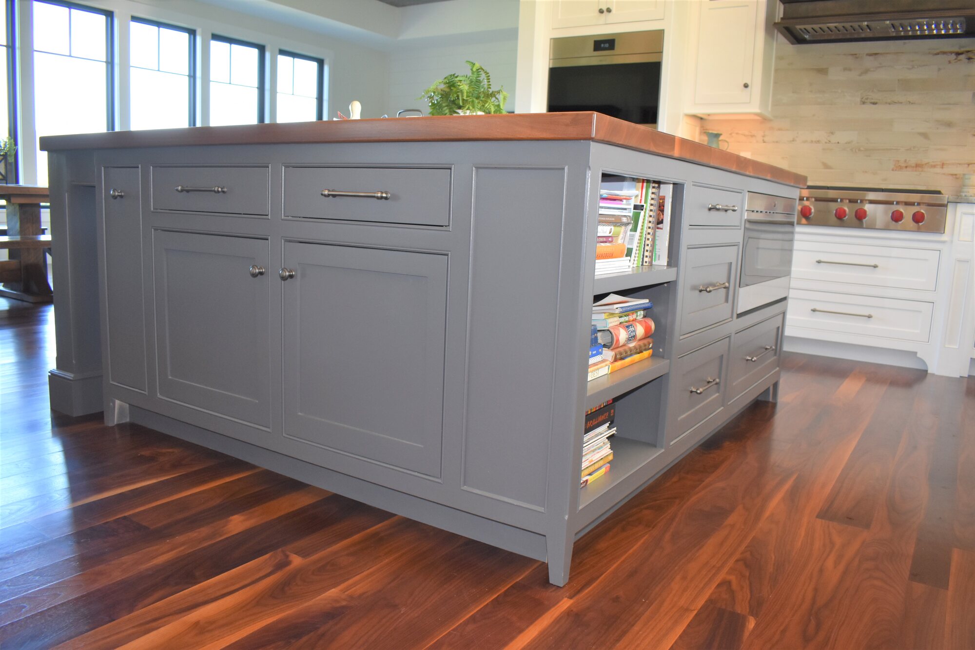 Blue kitchen island with display shelves