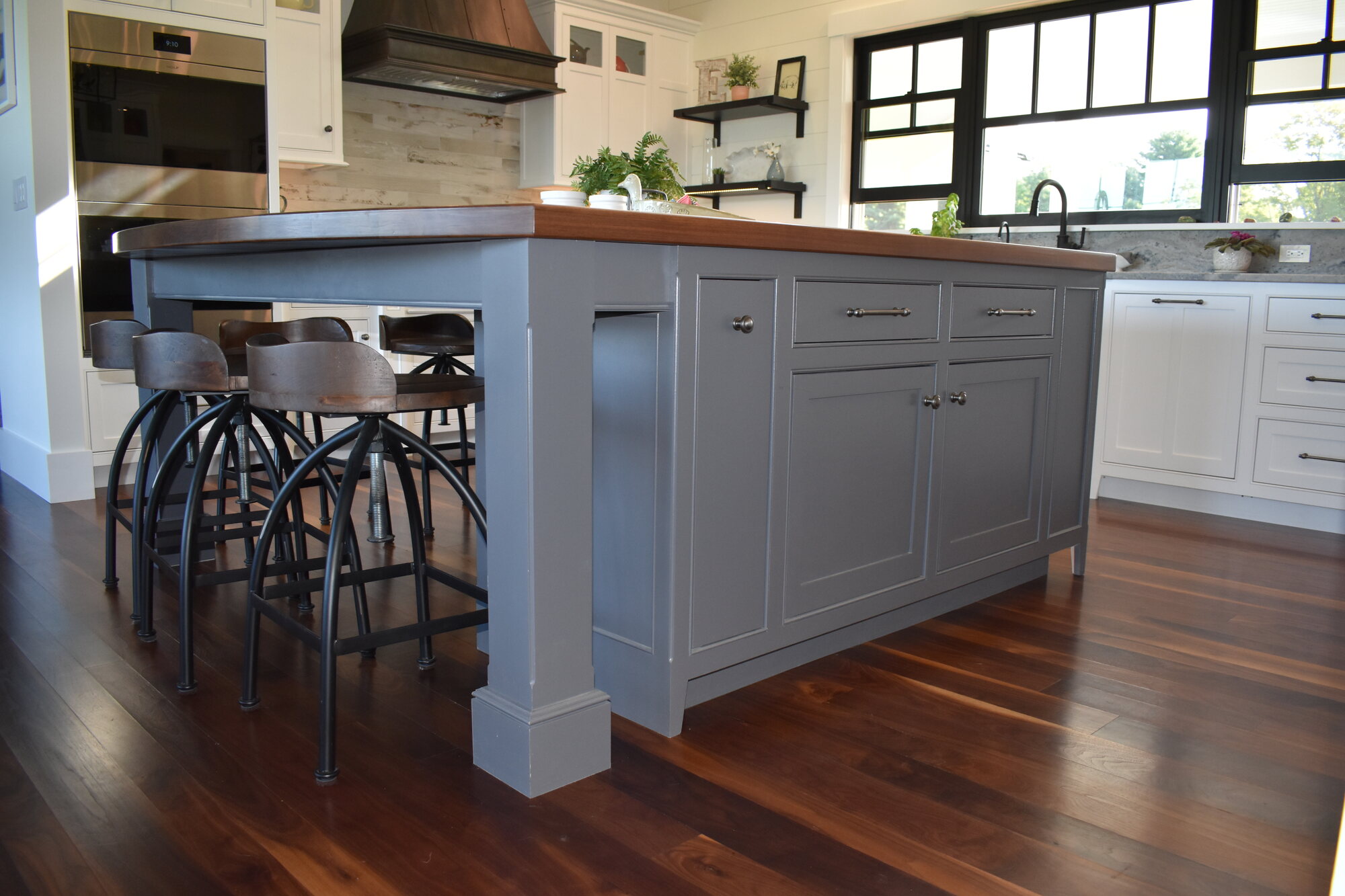 Blue kitchen island with seating and storage