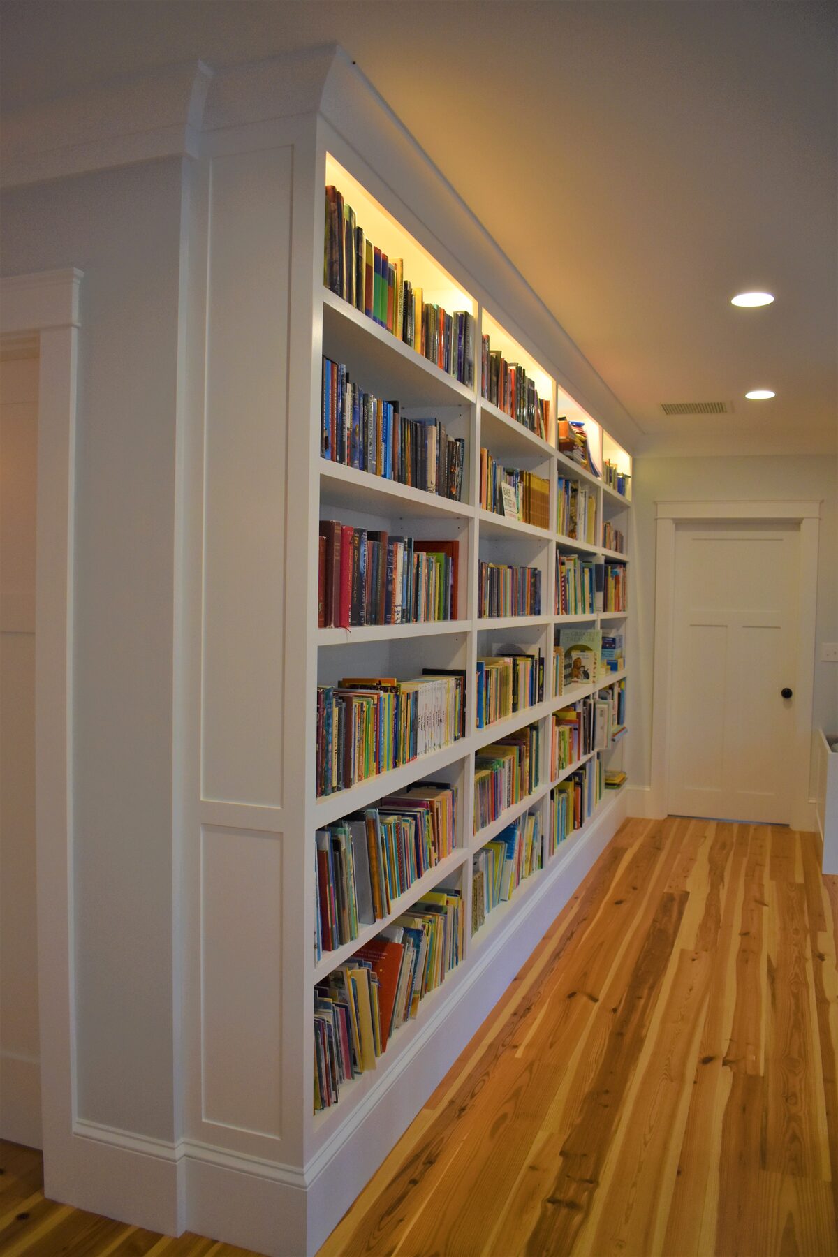 White built-in bookcase wall