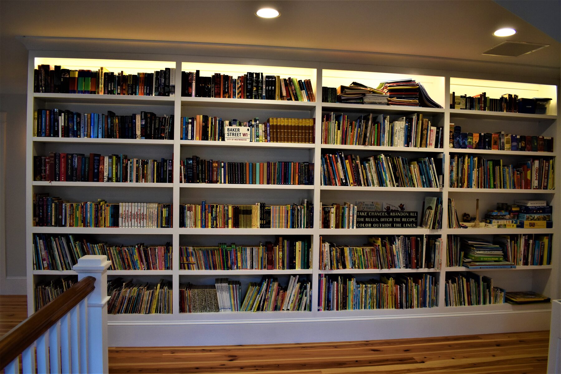 White built-in bookcase along hallway