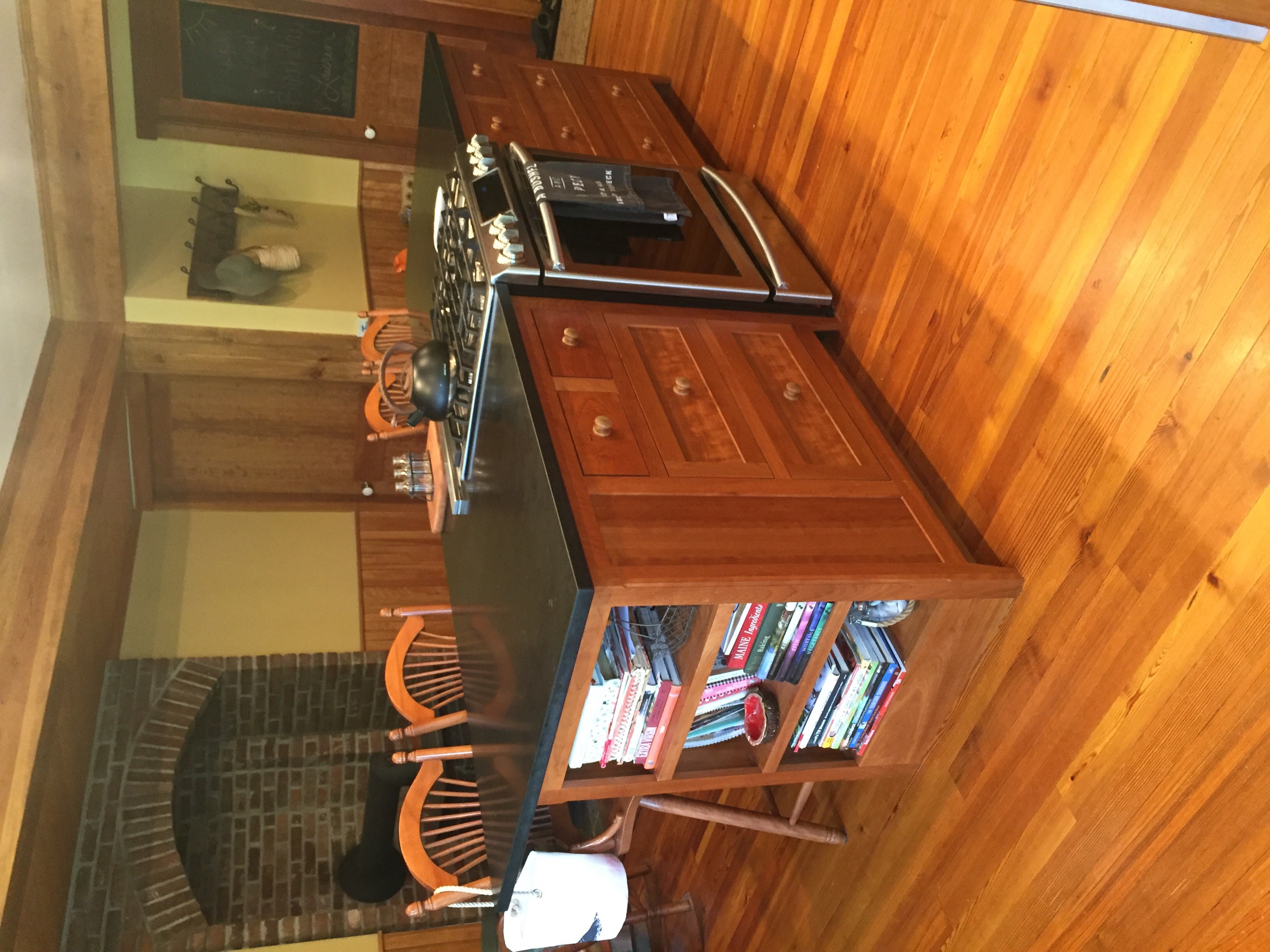 Cherry kitchen island with open cookbook storage