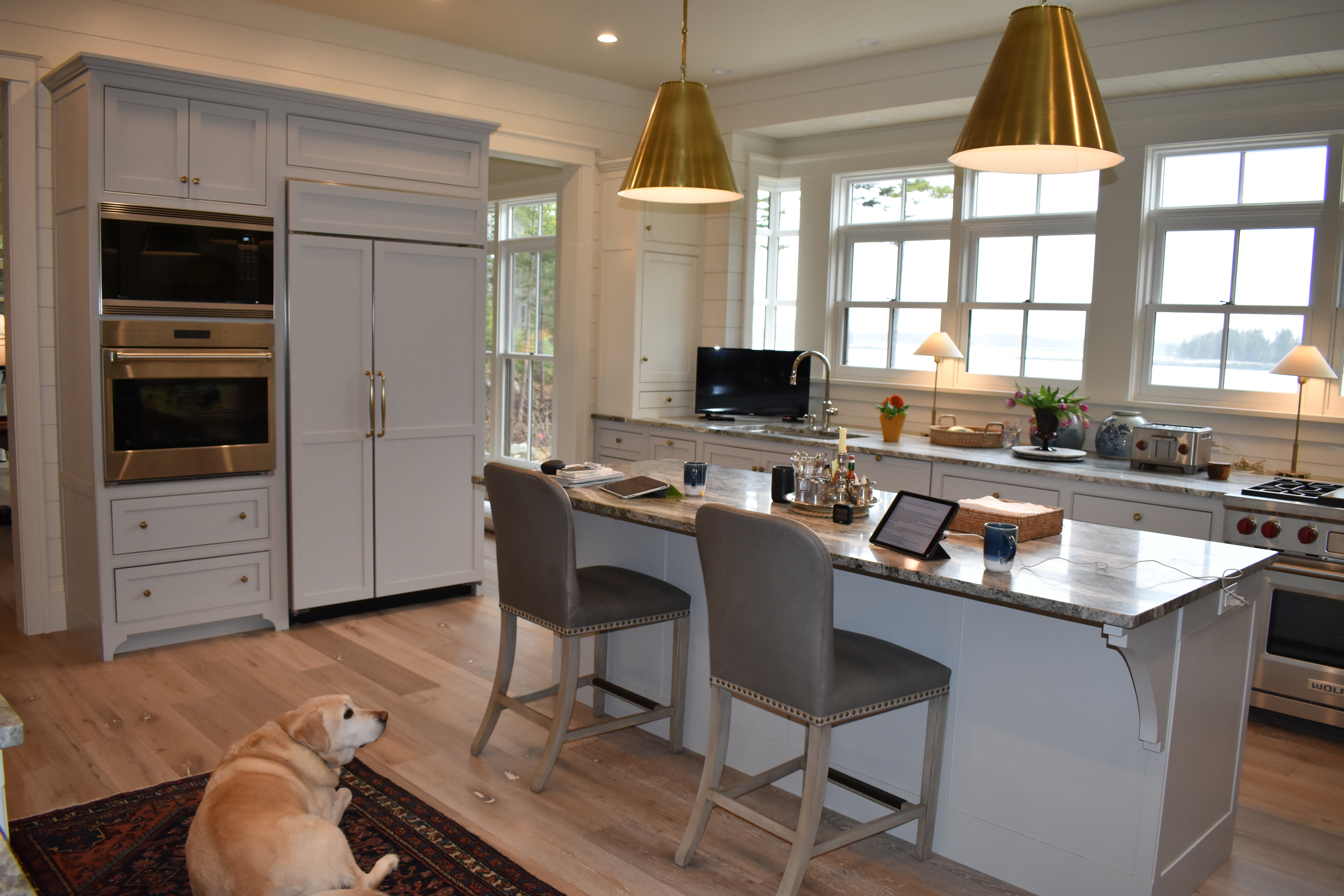 Classic custom kitchen with island and white cabinetry