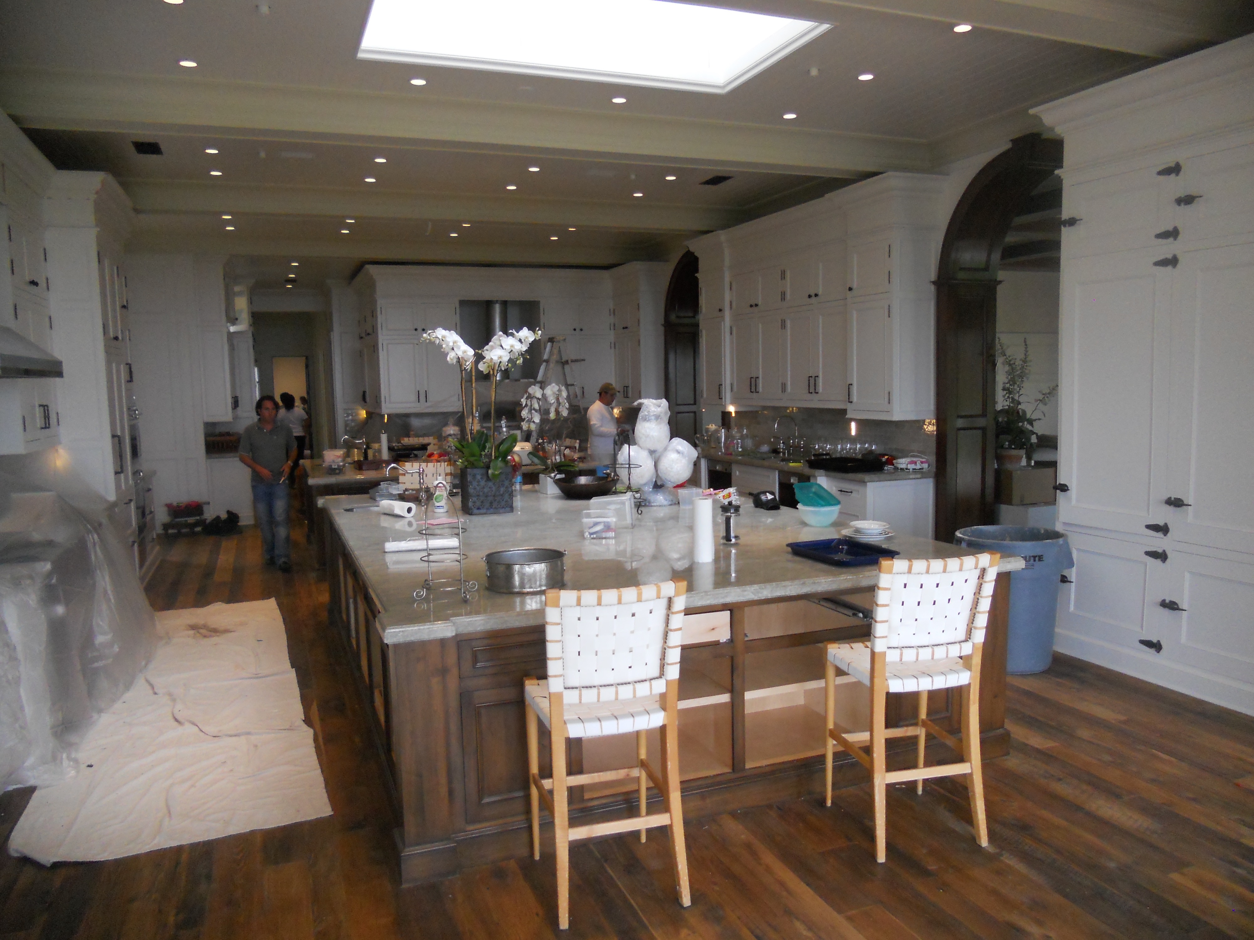 White kitchen with island and open dining area