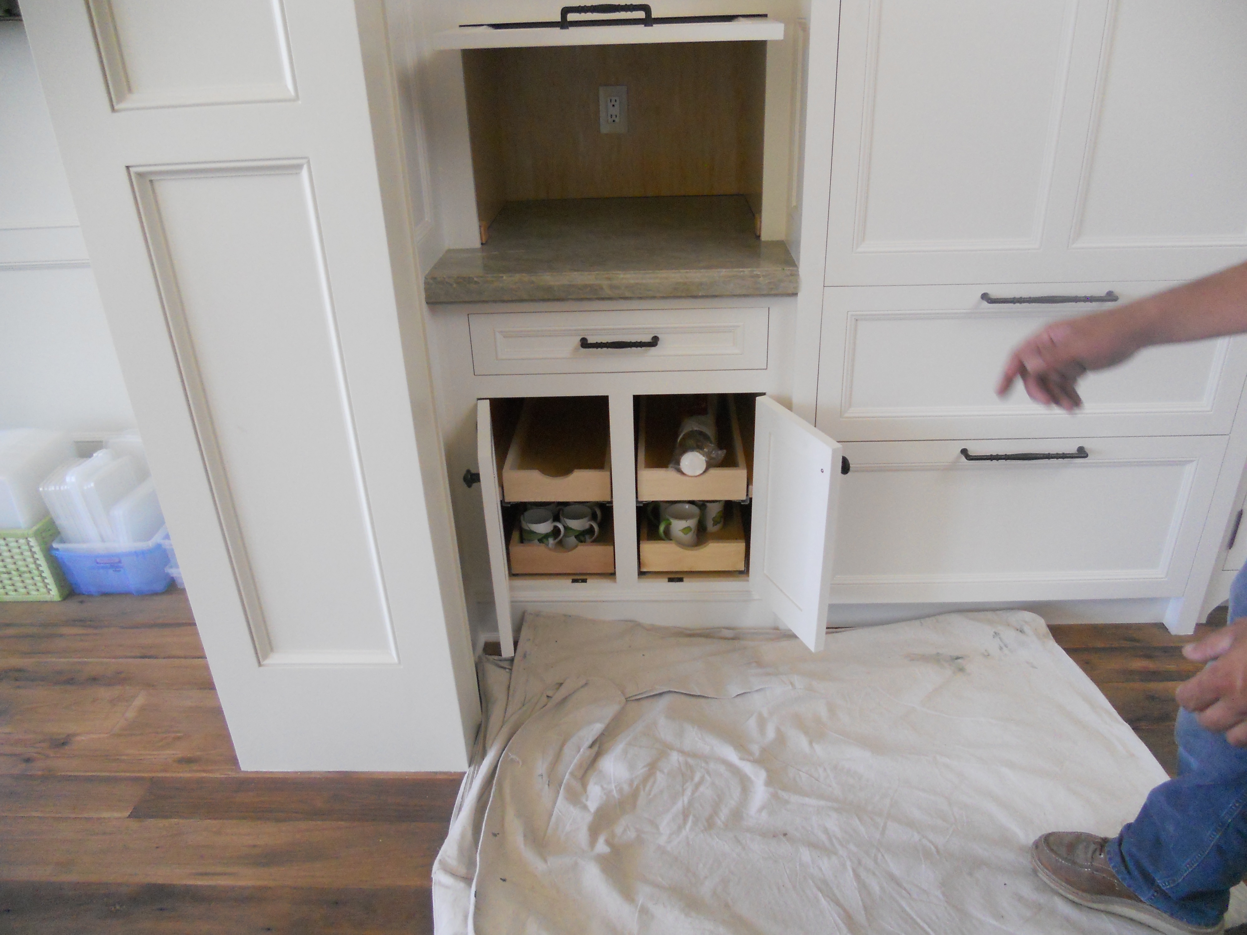 Built-in cabinet detail below a kitchen hood