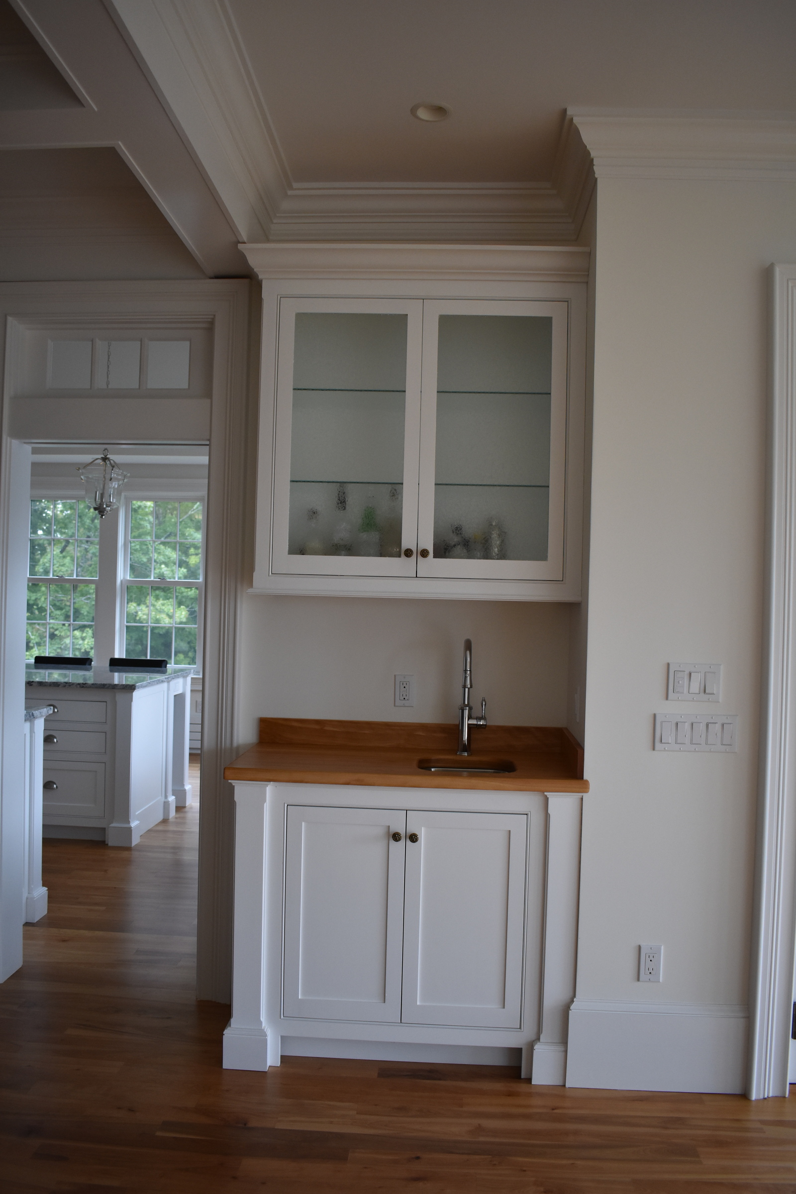 Coastal white kitchen beverage cabinet detail
