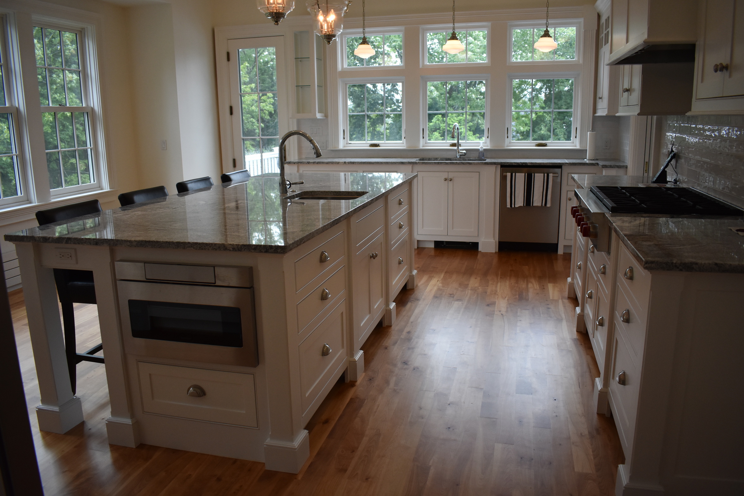 Coastal white kitchen island and sink wall