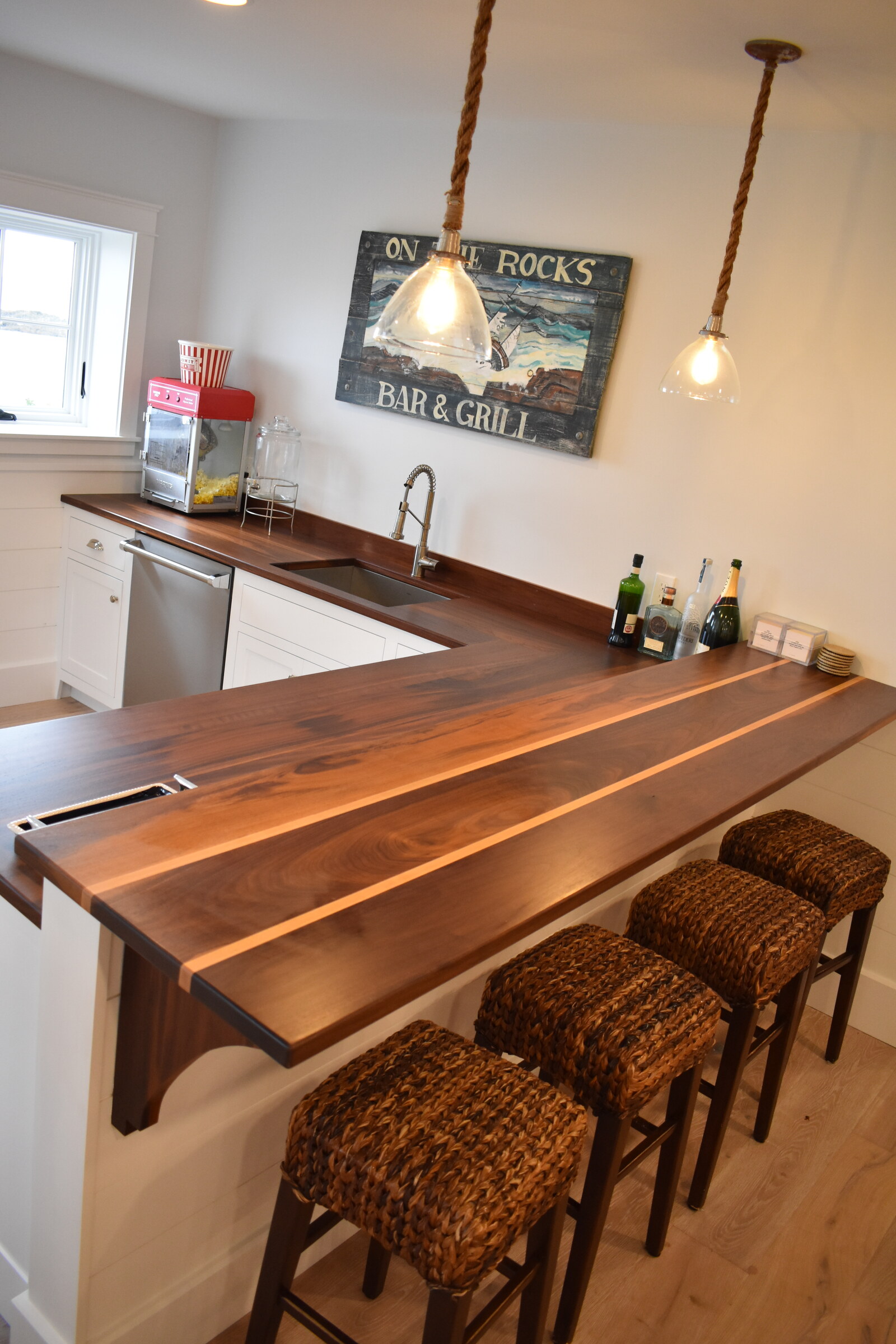 Custom wood bar table and wall cabinetry