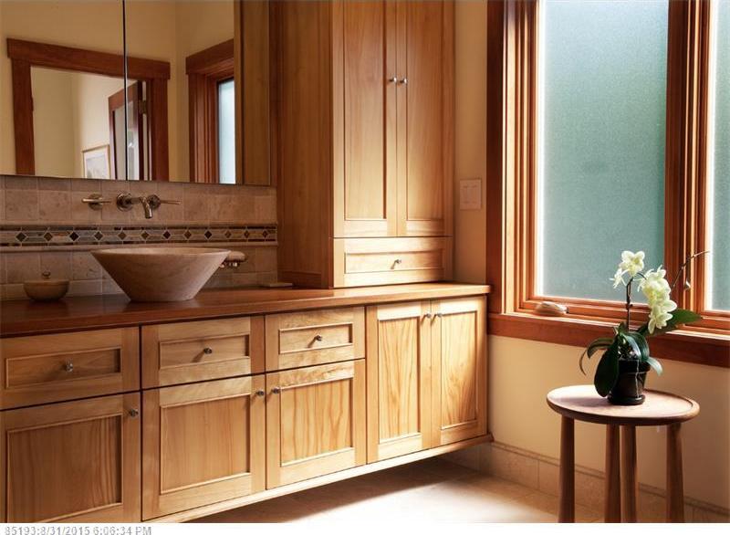 Bathroom vanity and mirror with wood cabinetry