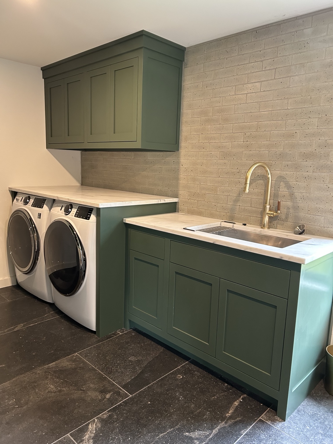 Green laundry room cabinetry