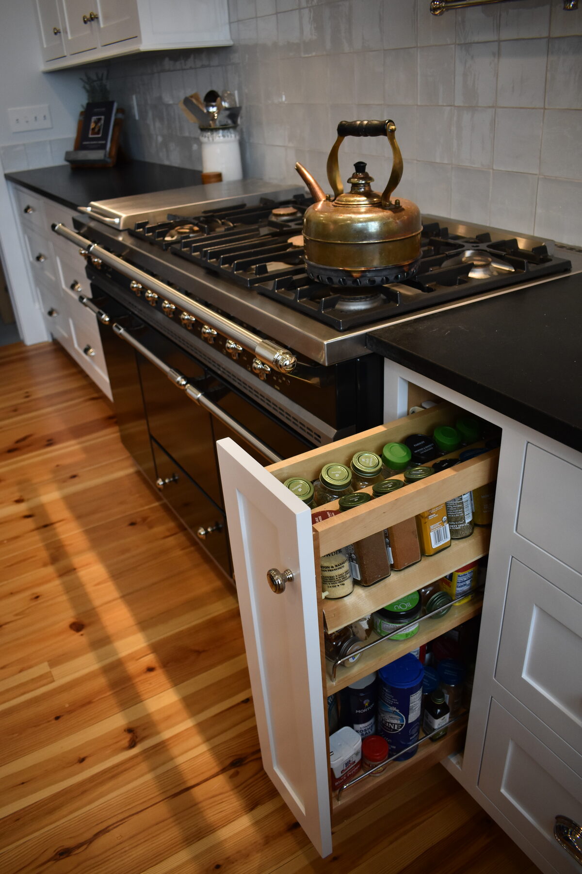 White kitchen range hood with tile backsplash