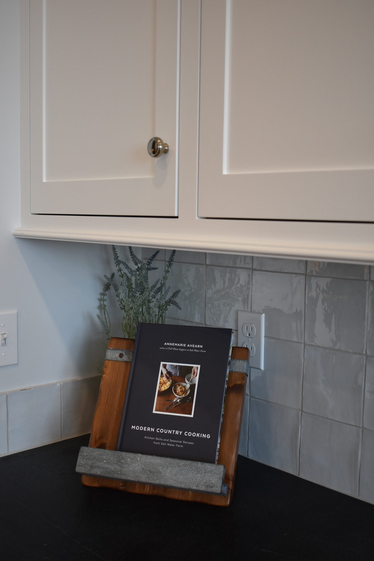 Kitchen range and pot filler below custom cabinetry
