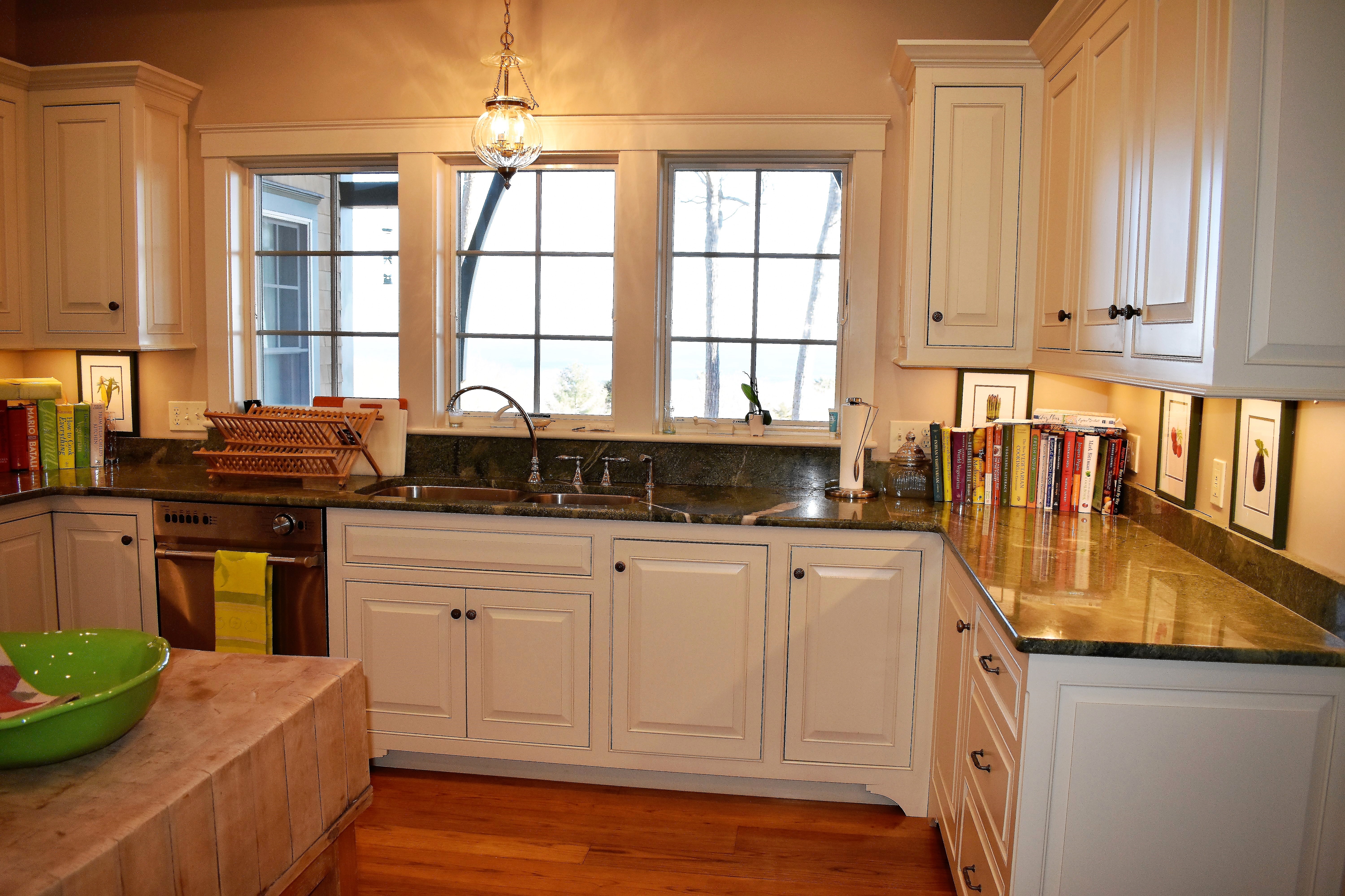 Traditional kitchen with white island and warm wood cabinetry