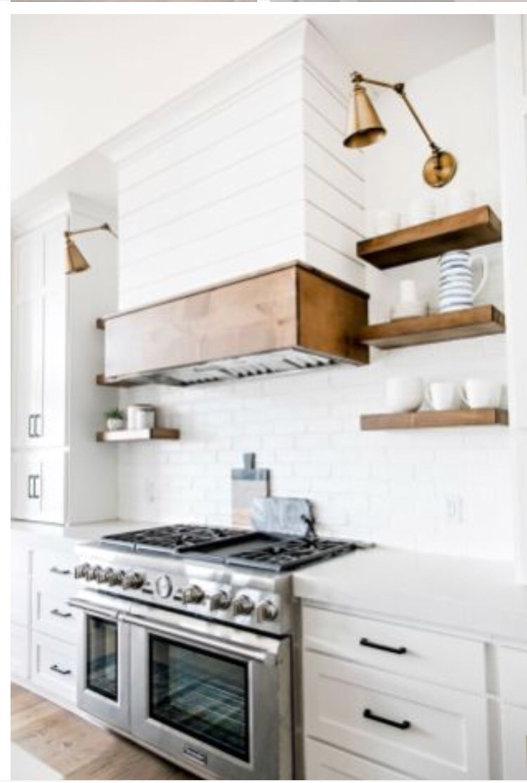 Painted farmhouse style kitchen cabinetry and storage