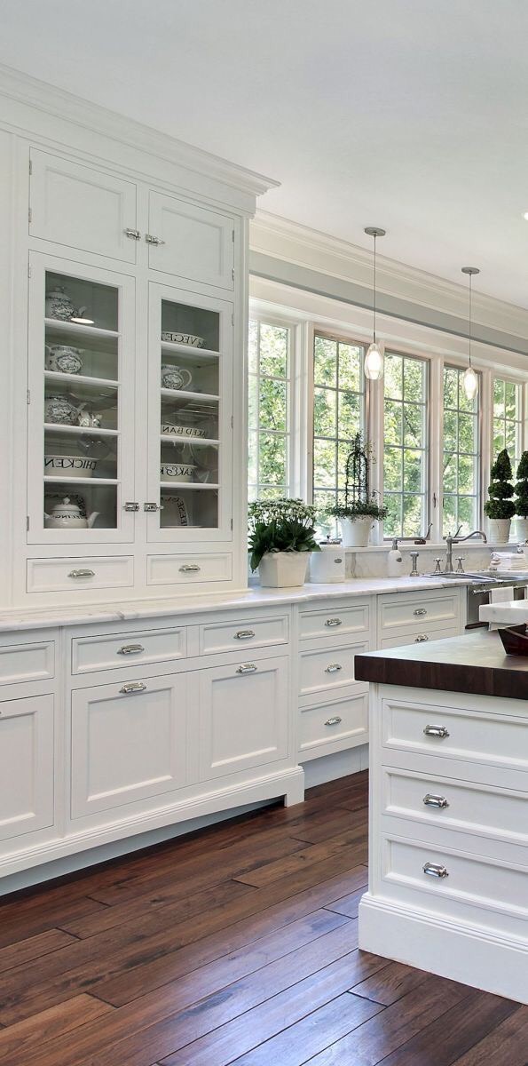 Painted farmhouse style kitchen tall cabinetry