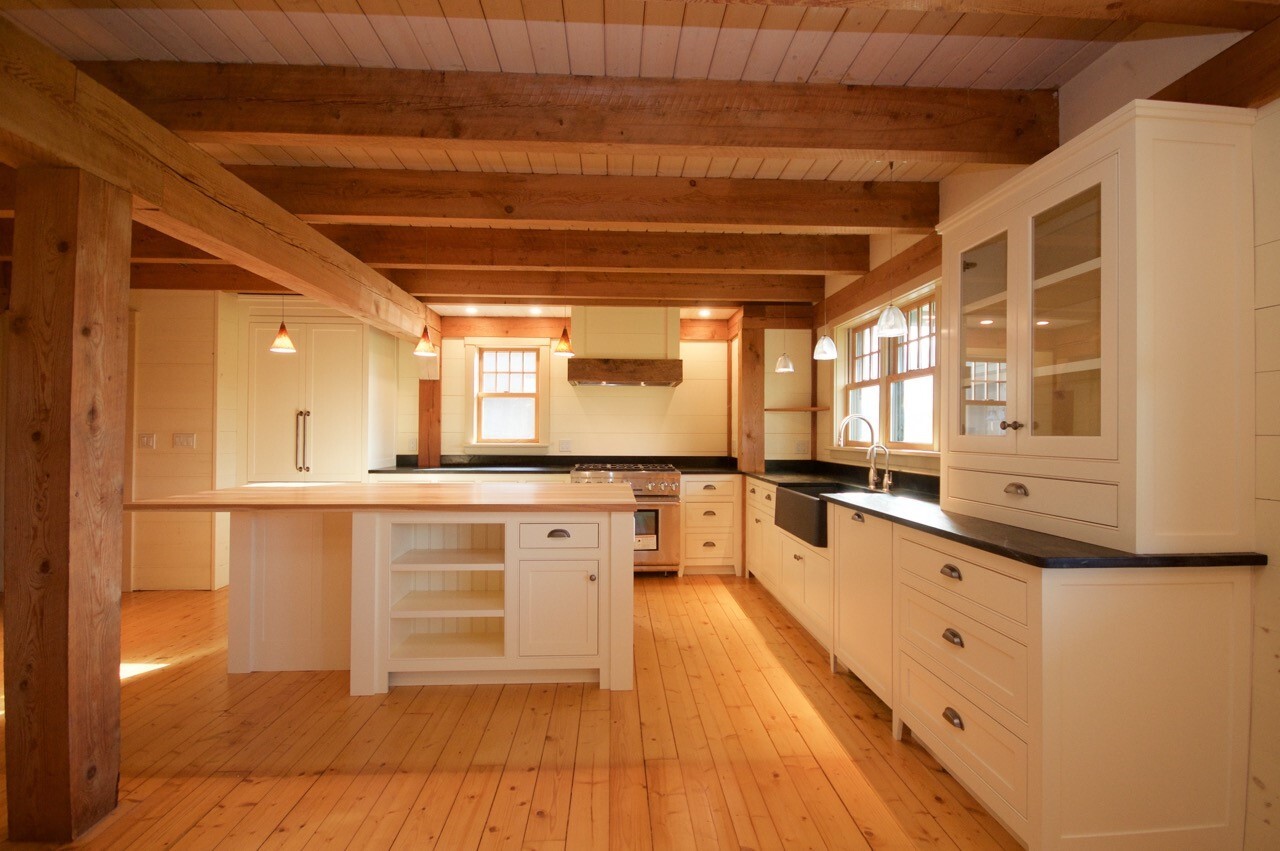 Natural wood kitchen wide view with custom cabinetry