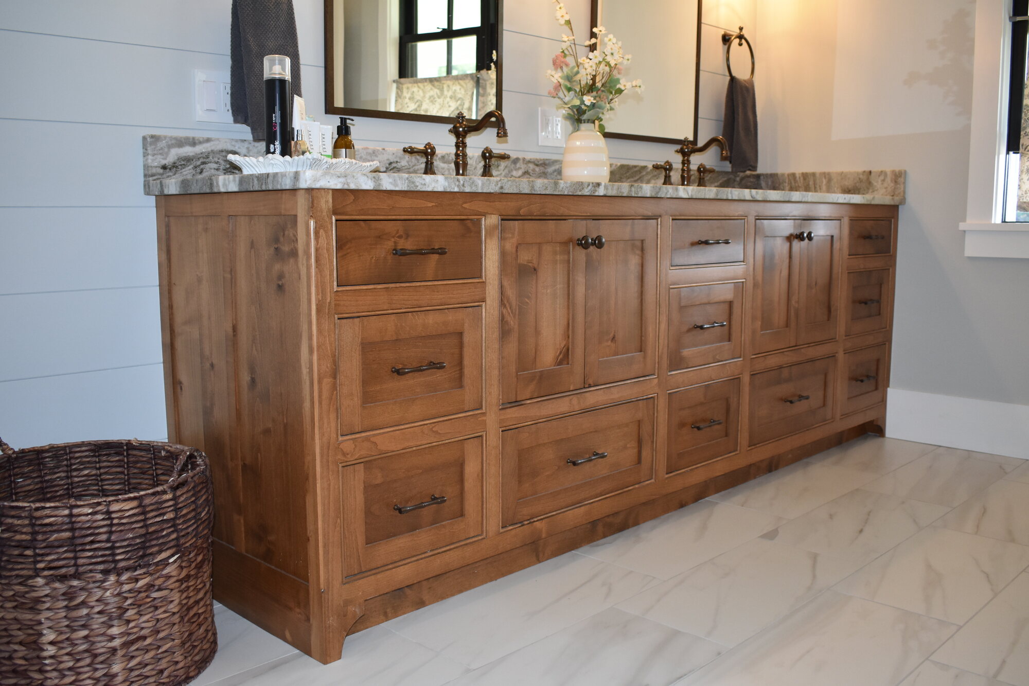 Natural wood double vanity and linen storage