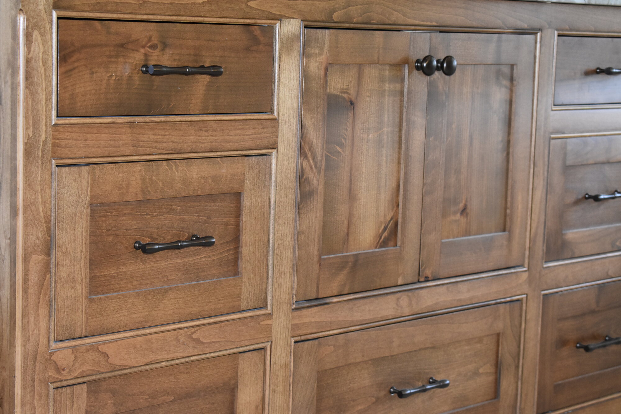 Natural wood vanity drawer and door detail