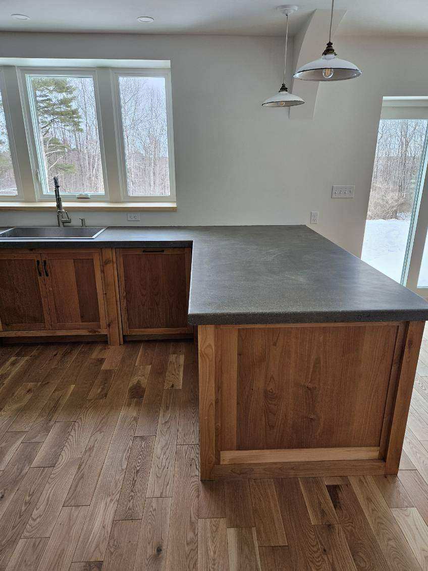 Natural wood island and sink wall