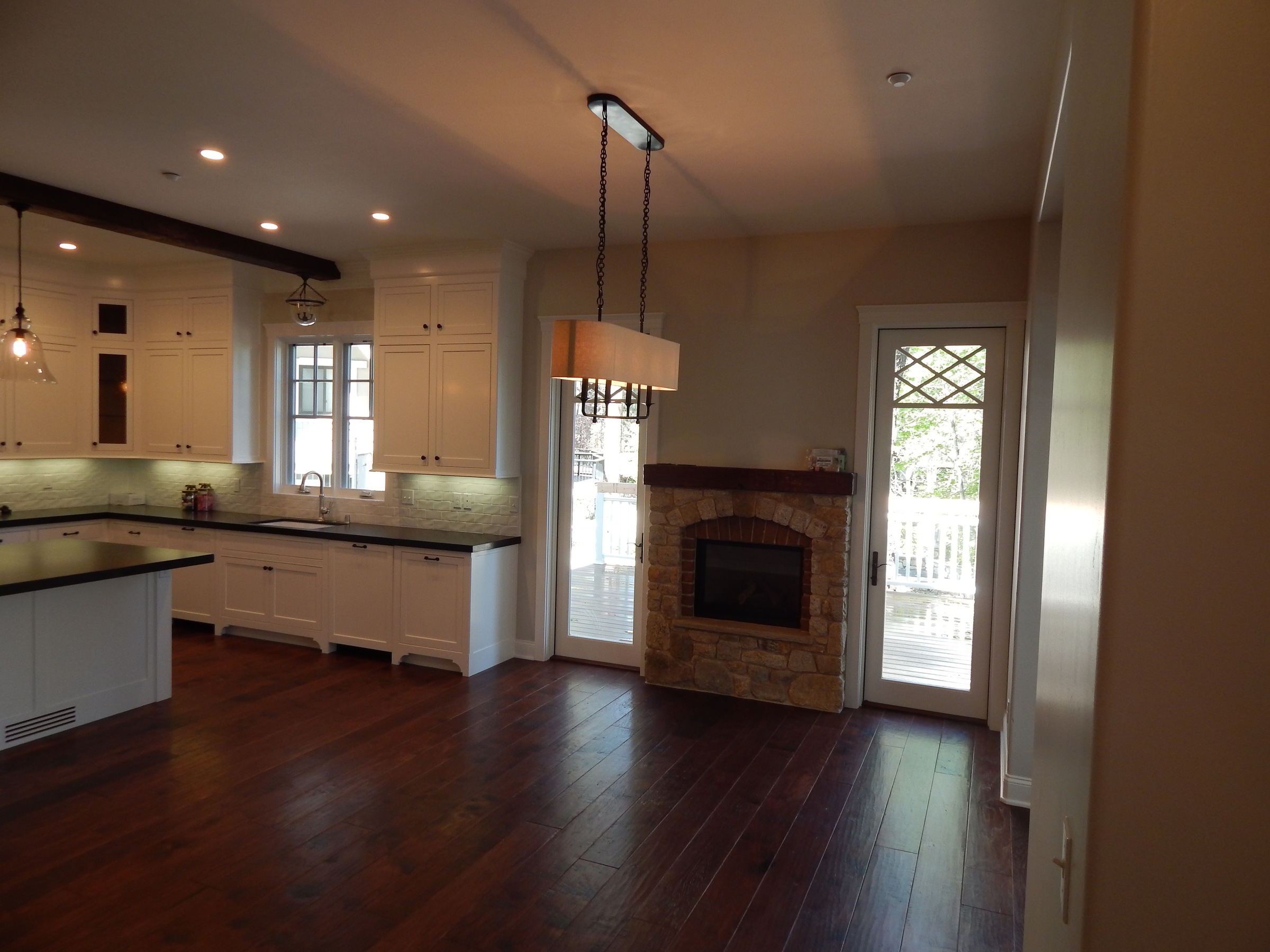 Open plan kitchen and living room with built-in cabinetry
