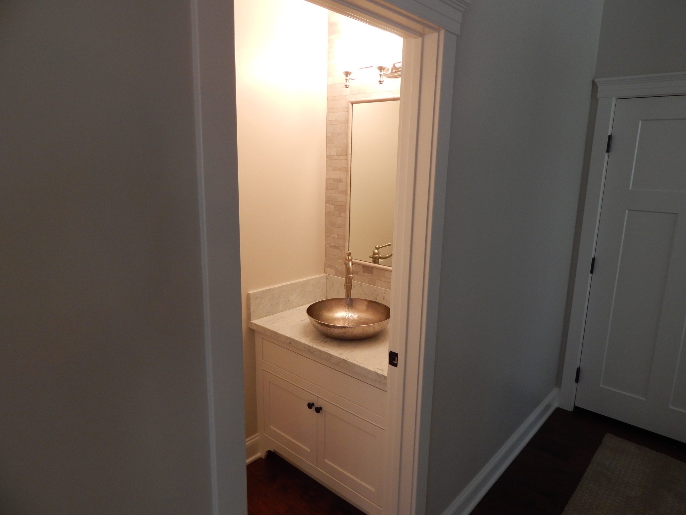 Powder room vessel sink vanity