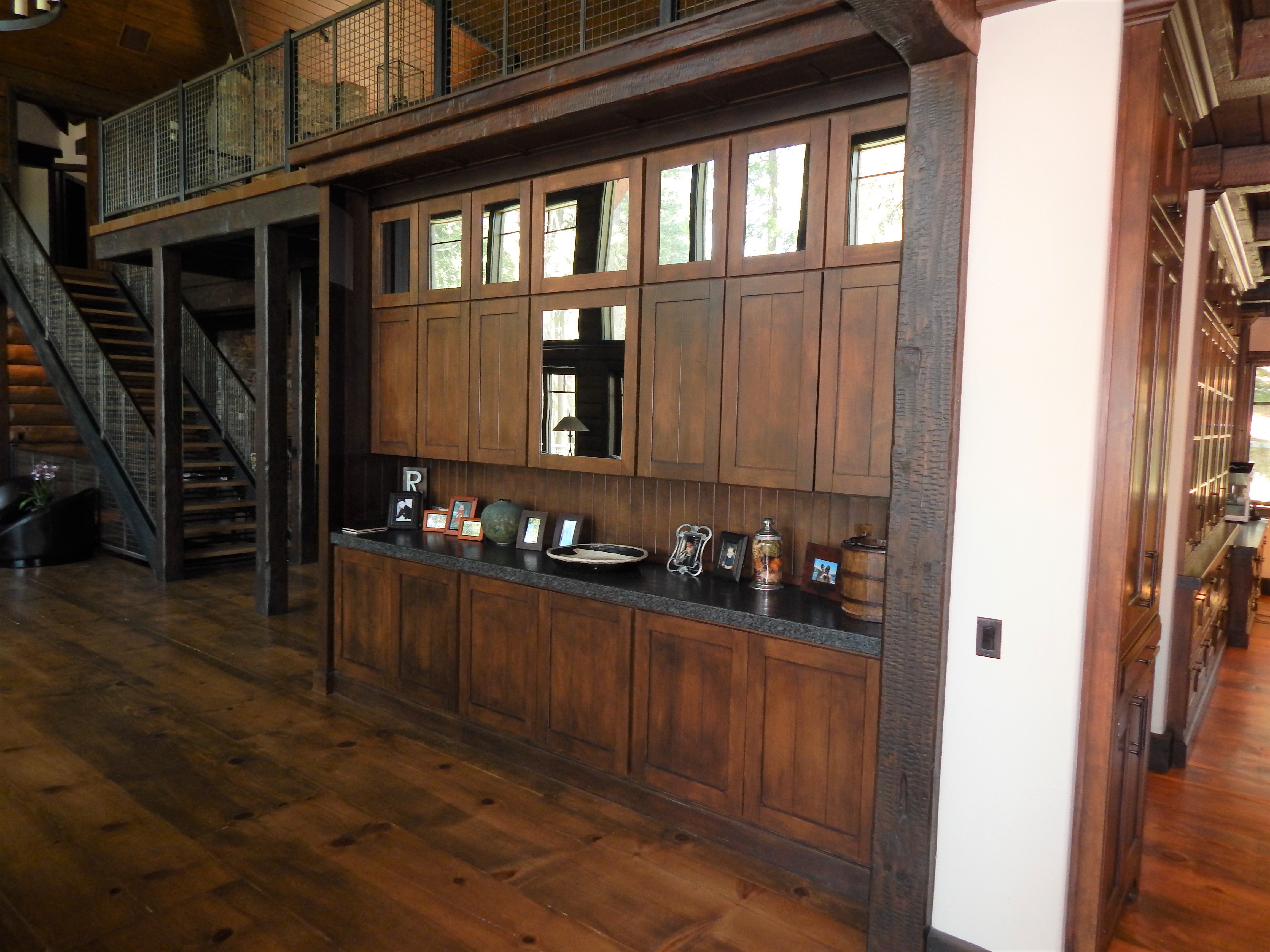 Paneled wood cabinetry beside staircase
