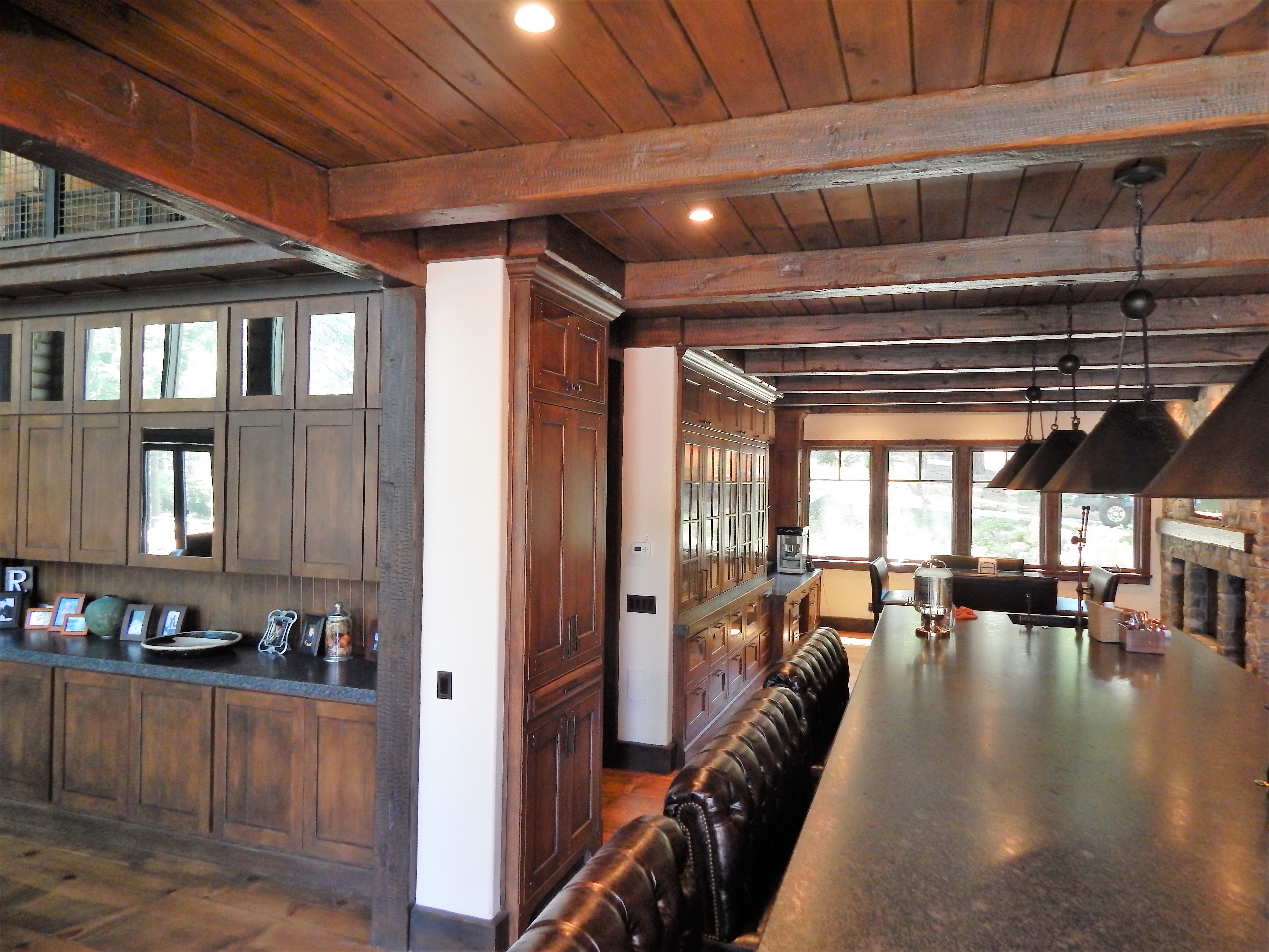 Rustic kitchen and dining area with wood ceiling beams