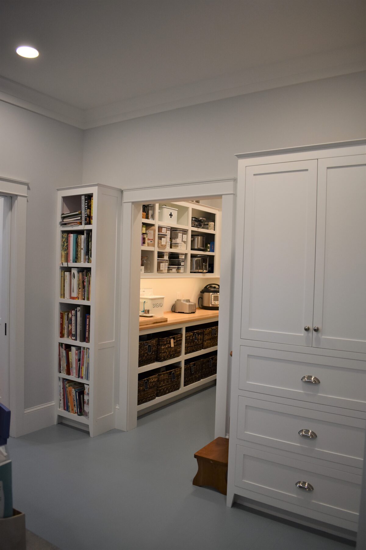 Entry storage cabinetry in walk-in pantry