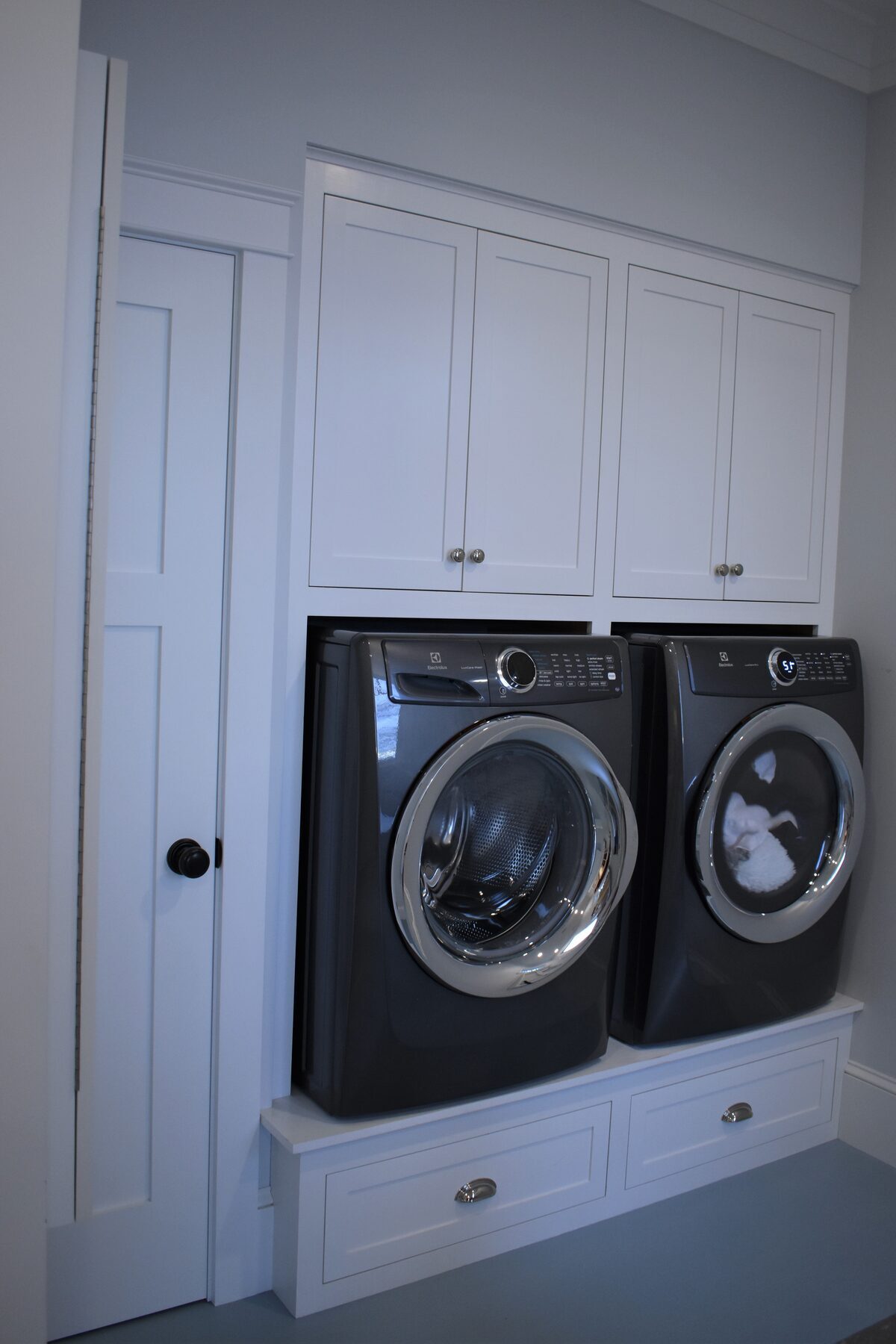 Laundry cabinetry in walk-in pantry