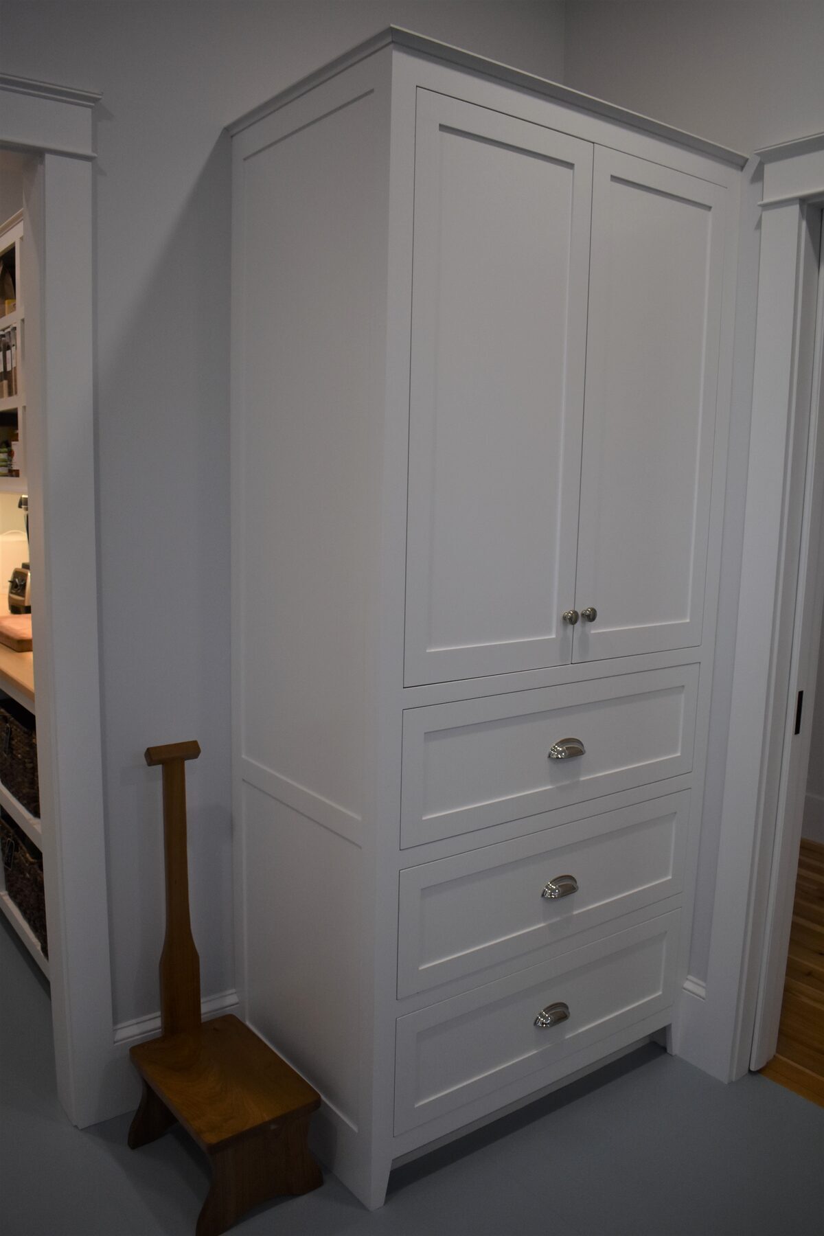 Tall storage cabinetry in walk-in pantry