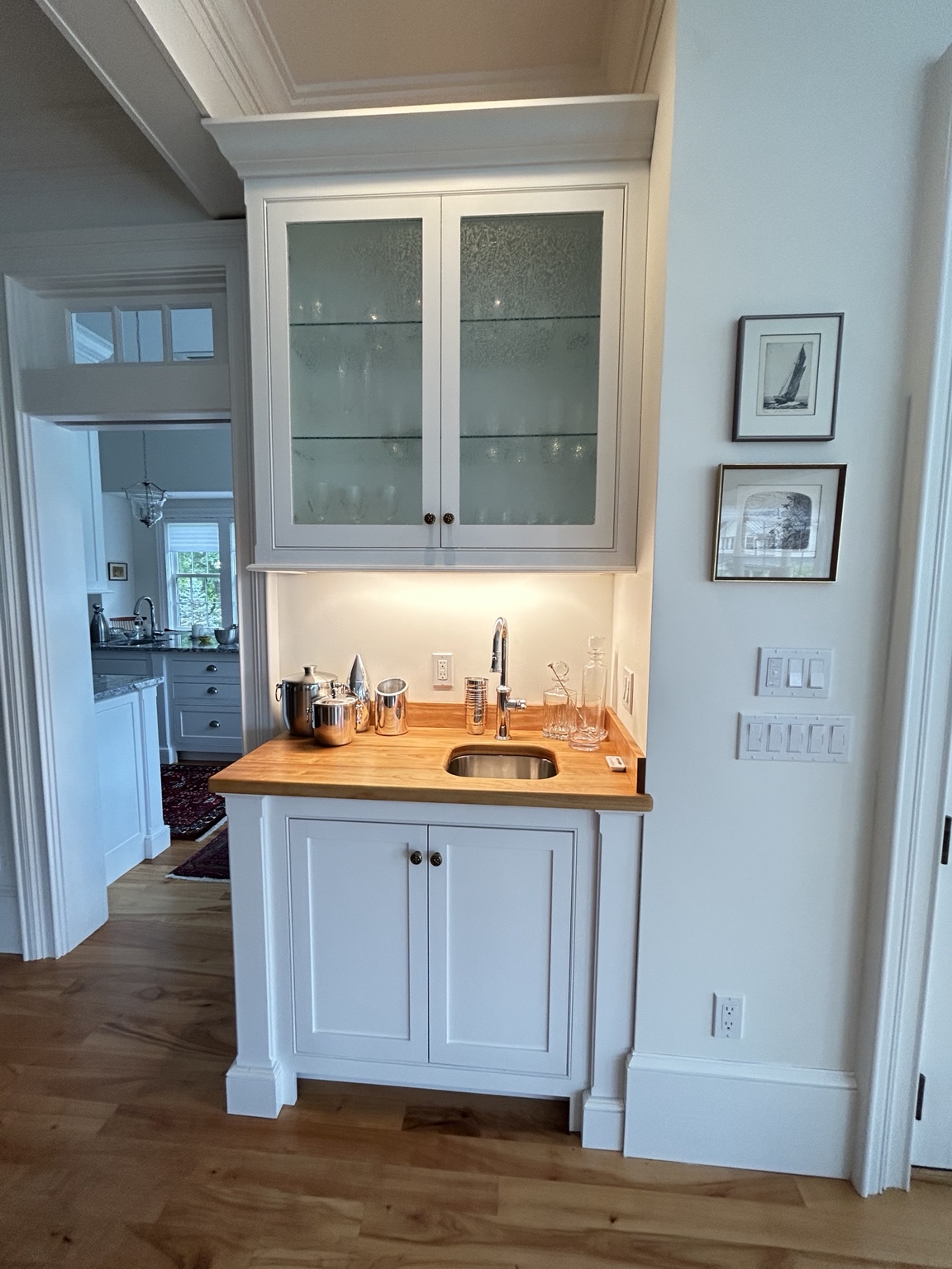 White beverage cabinet with wood counter
