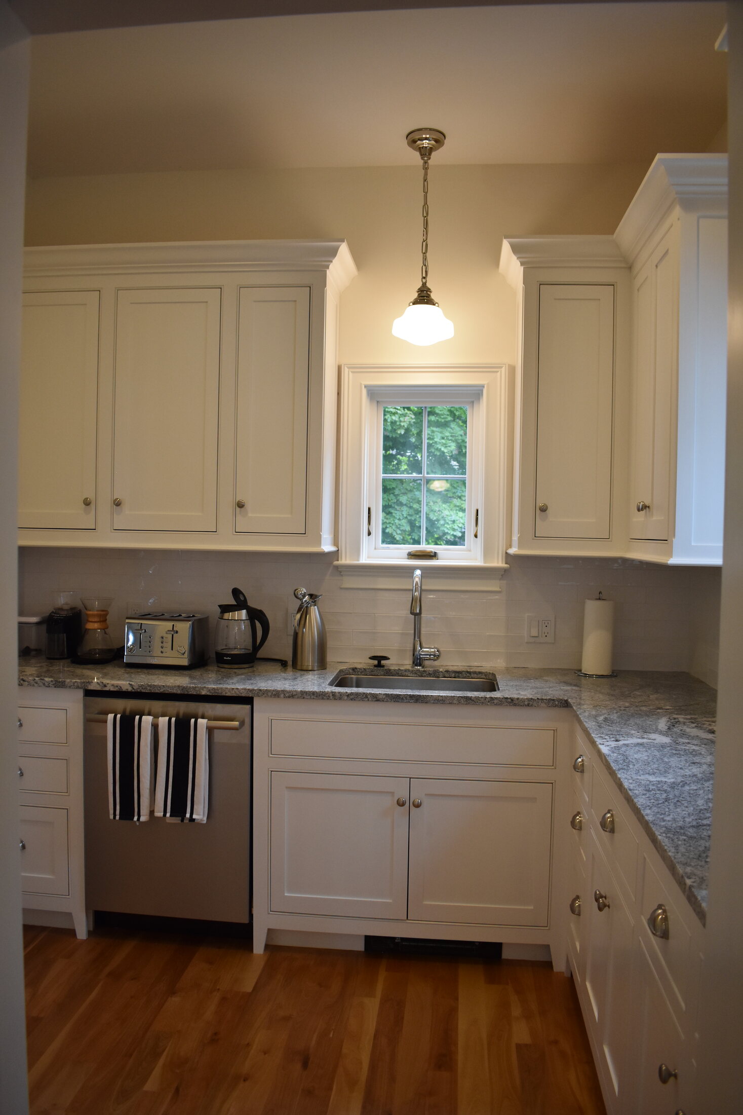 White kitchen appliance wall and island