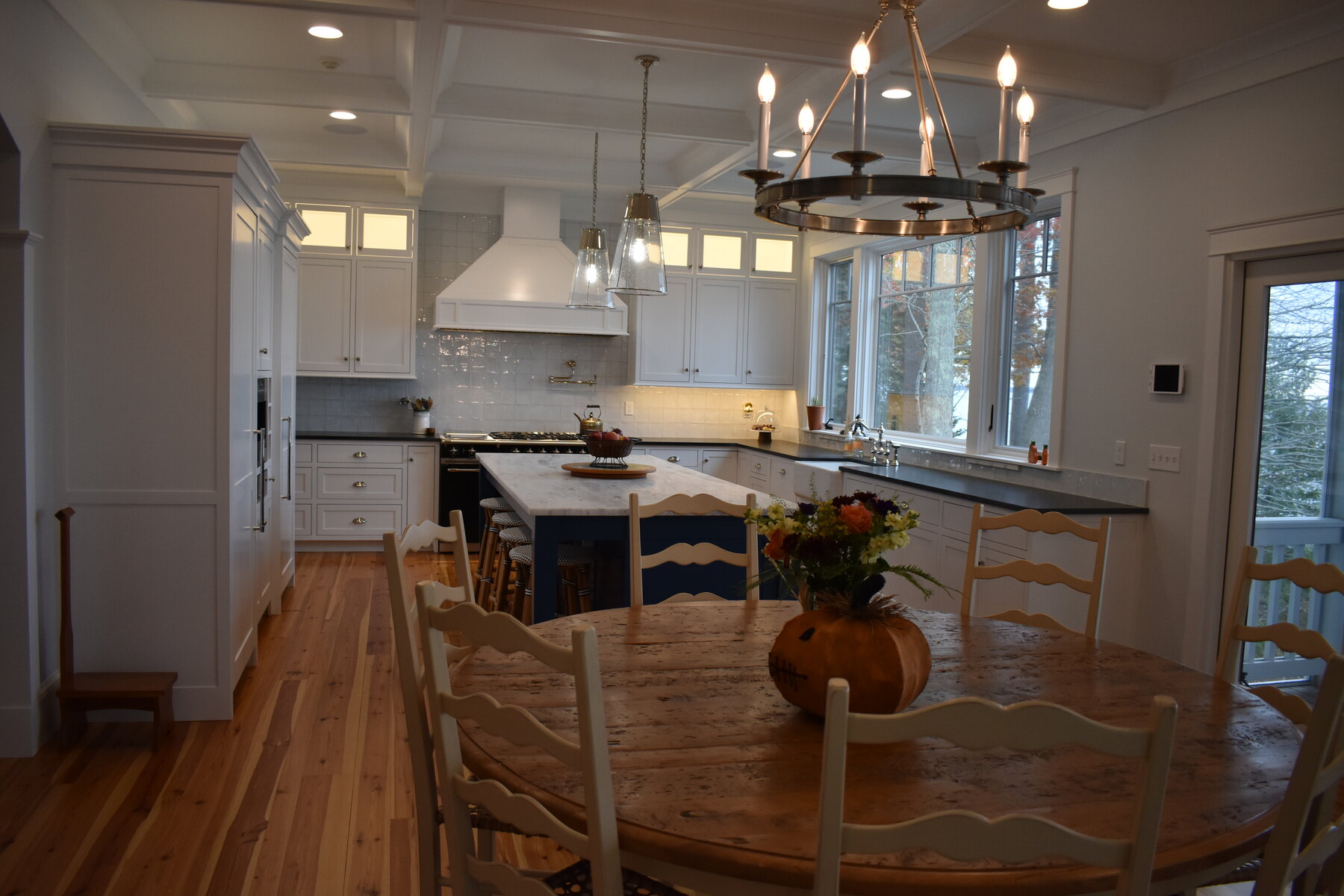 White kitchen with blue island cabinetry detail