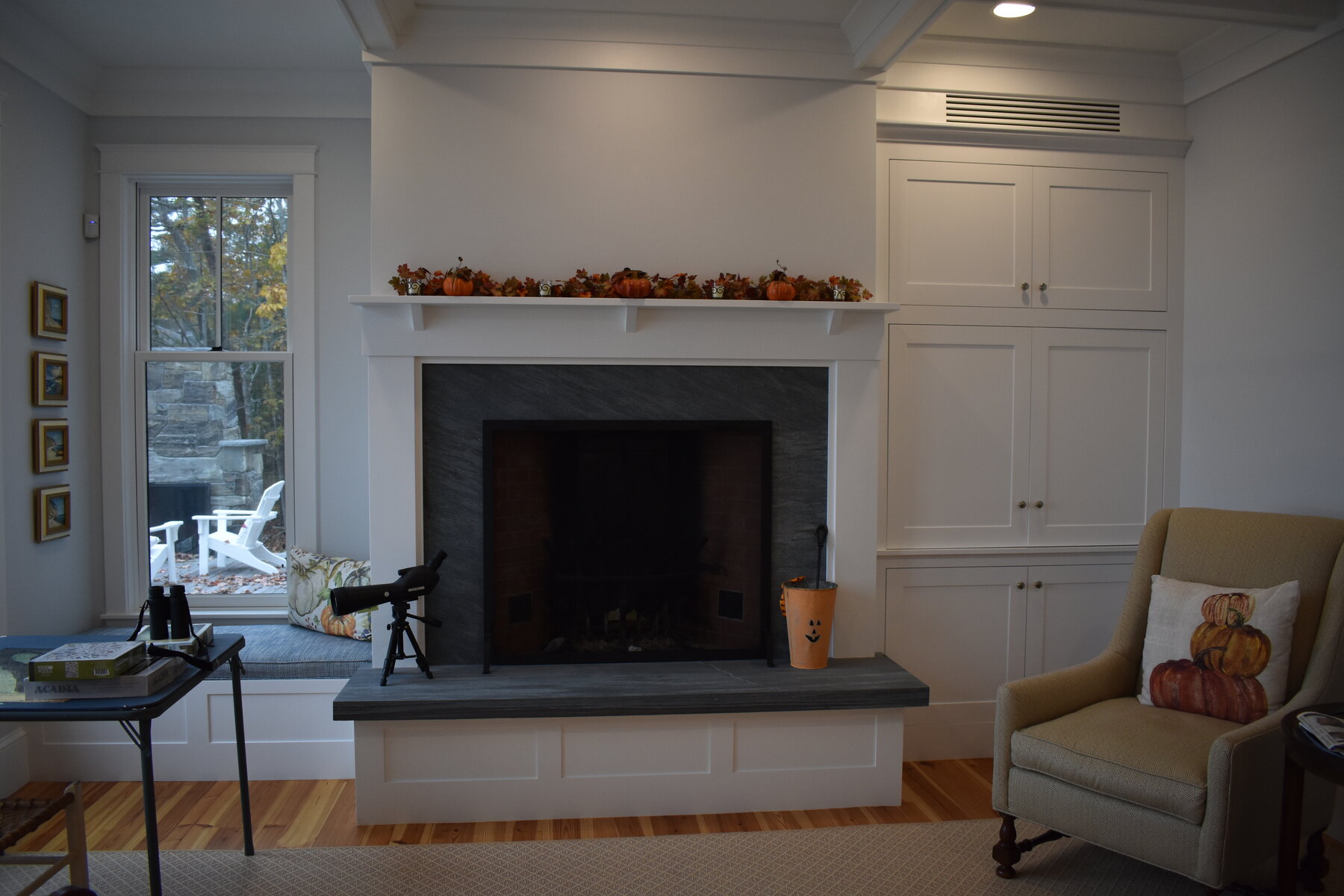 White kitchen with blue island and pendant lighting