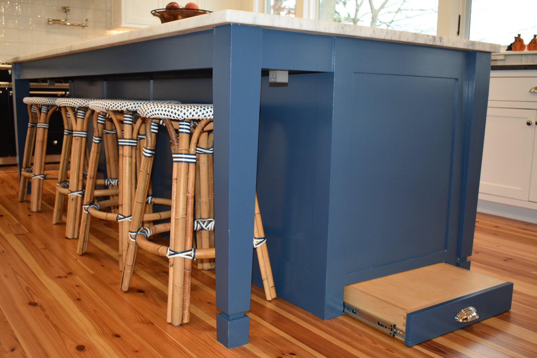 White kitchen sink wall and blue island