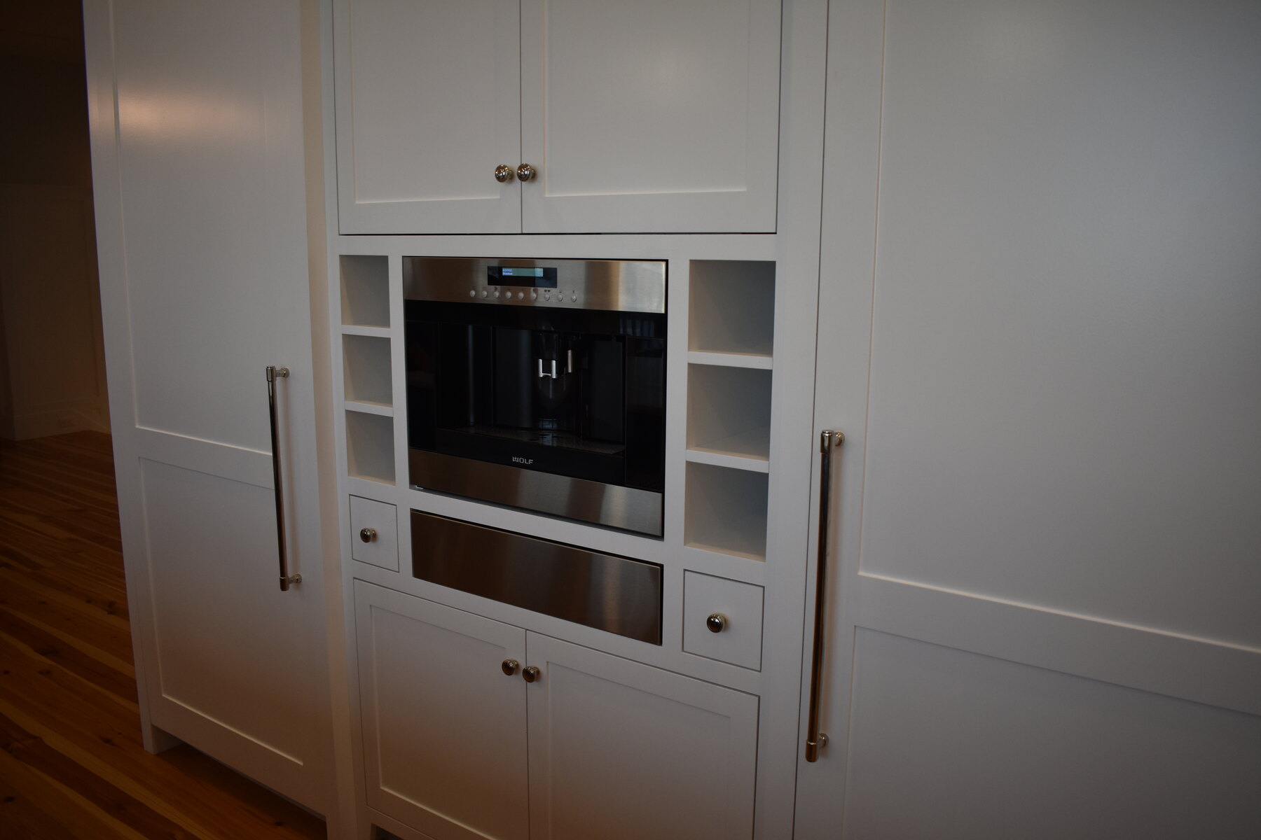 White kitchen appliance and cabinet wall