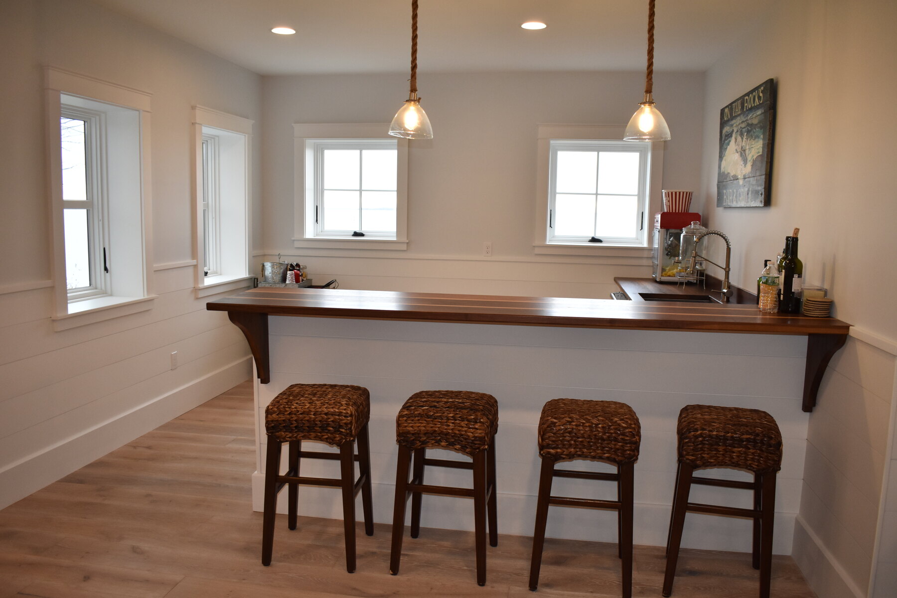 White kitchen range wall with blue island