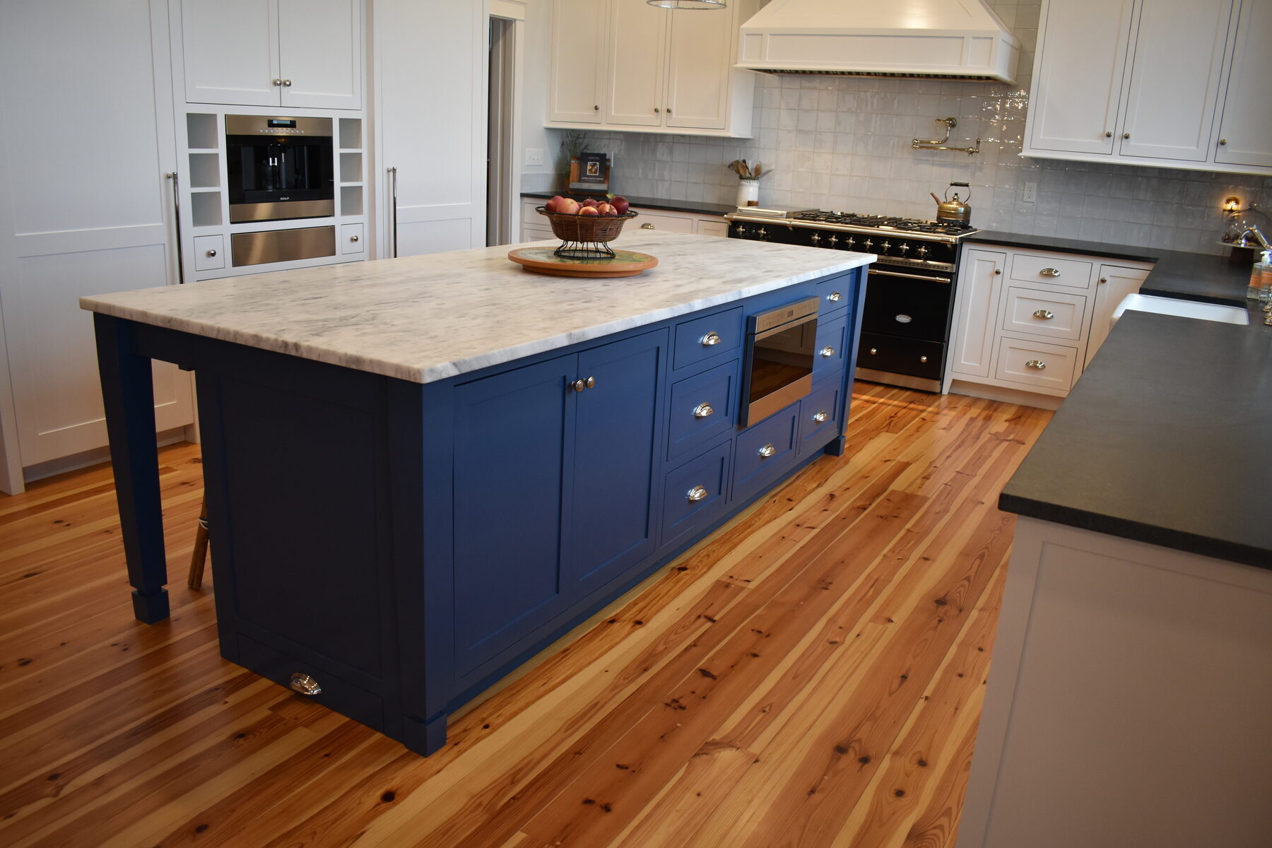 White kitchen with blue island