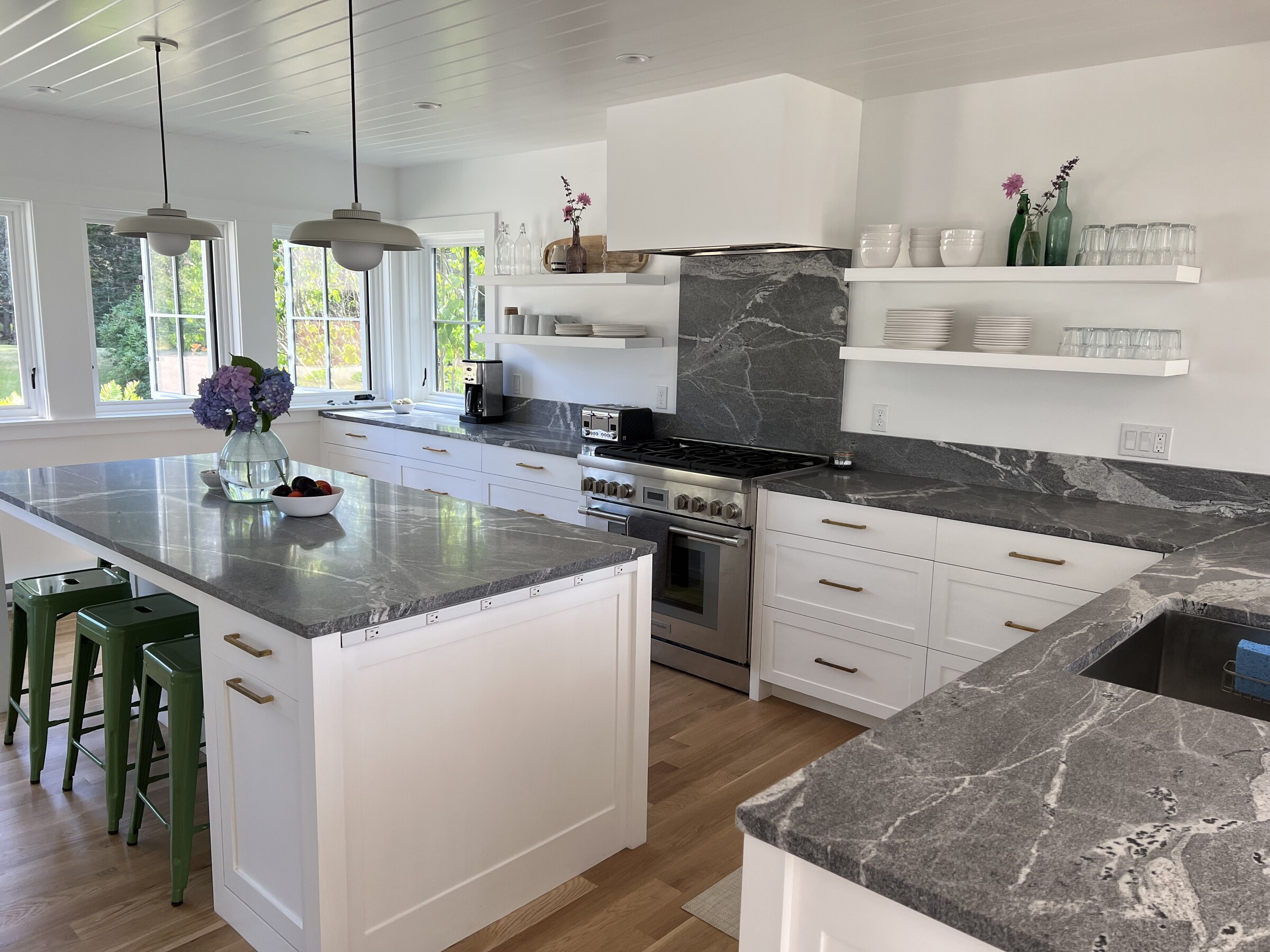 White kitchen with gray stone island
