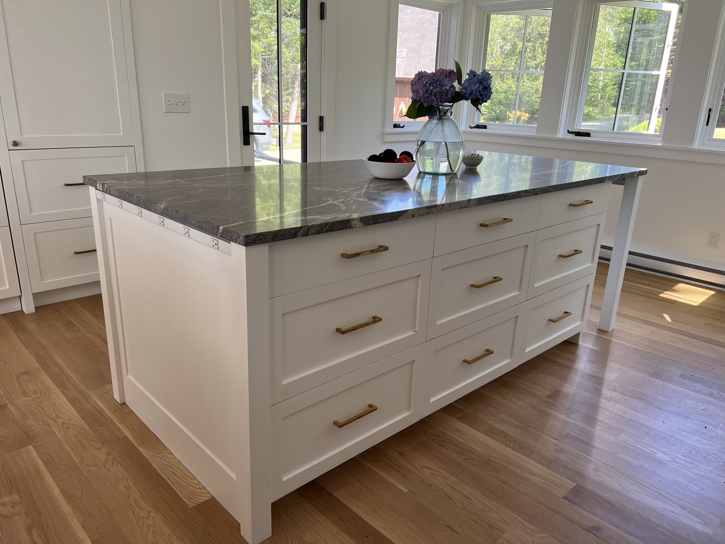 White kitchen range wall and island view