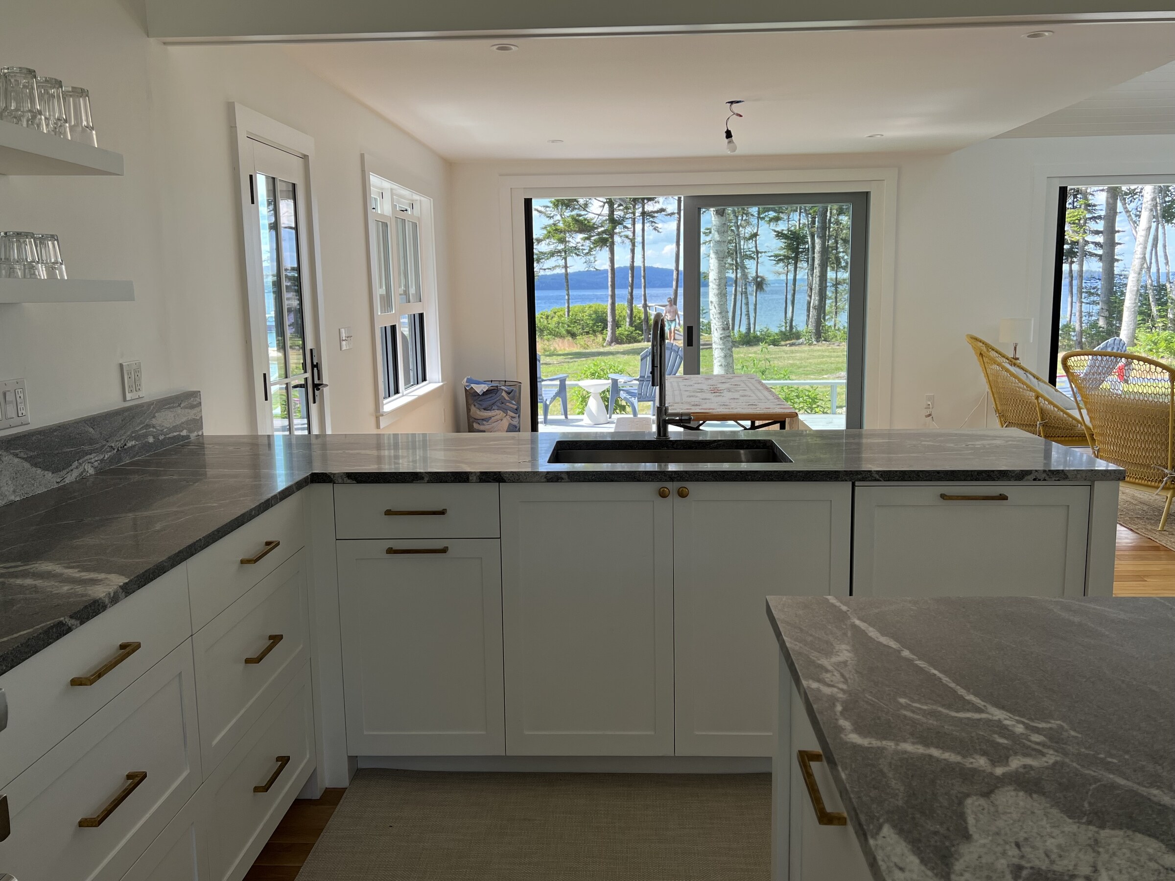 White kitchen gray stone island detail
