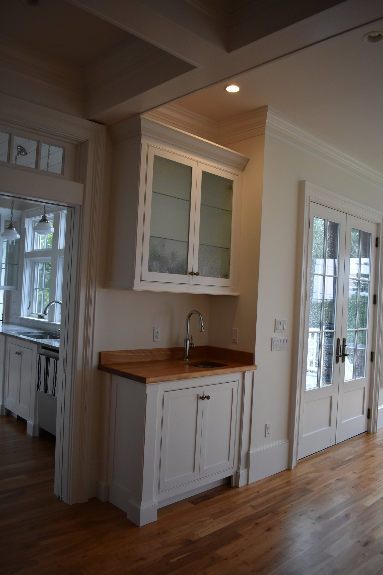 White kitchen island with bar seating