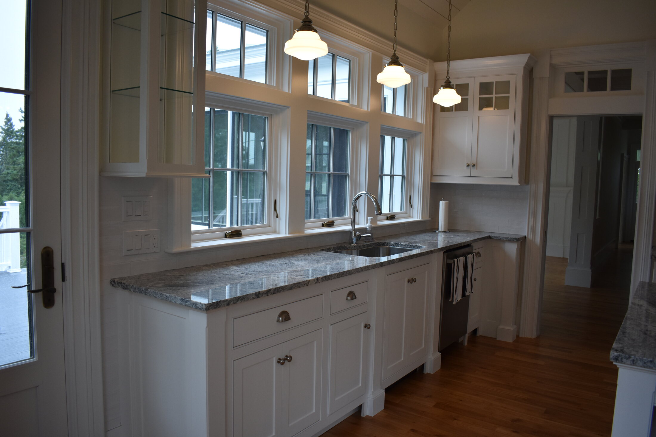 White kitchen range wall cabinetry