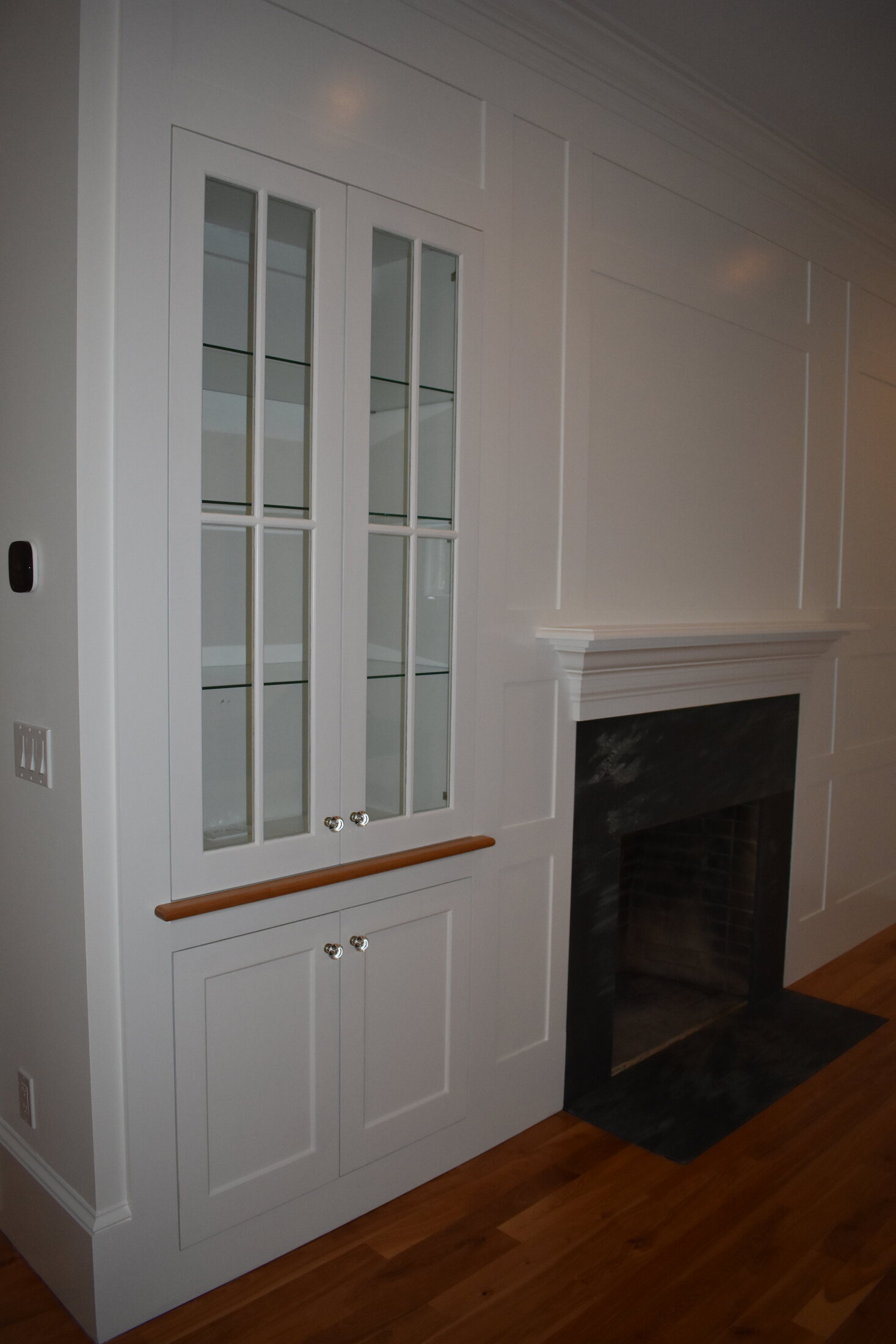 White bathroom vanity with dark counter